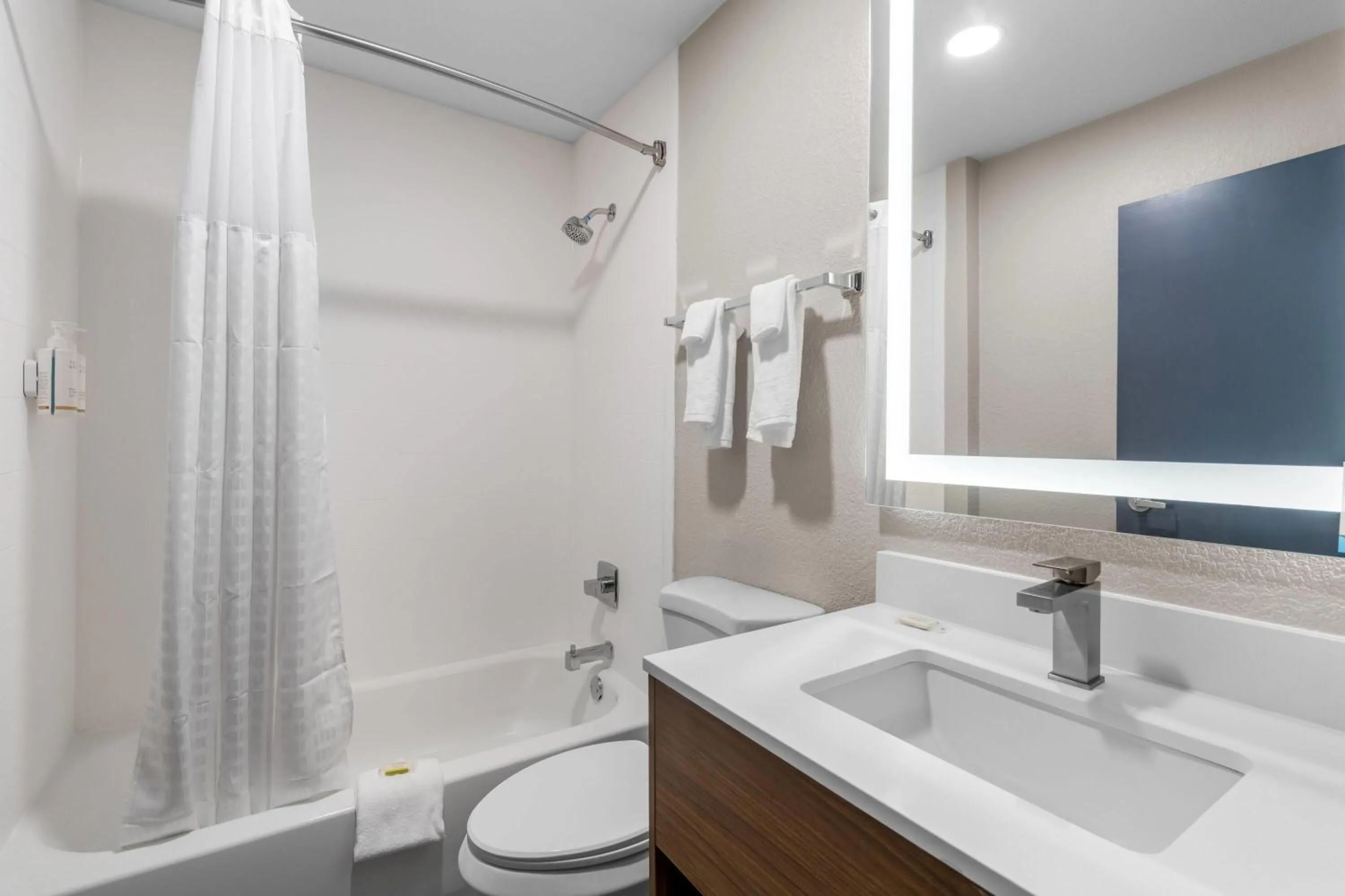 Bathroom in Days Inn & Suites by Wyndham Brandon Amphitheater