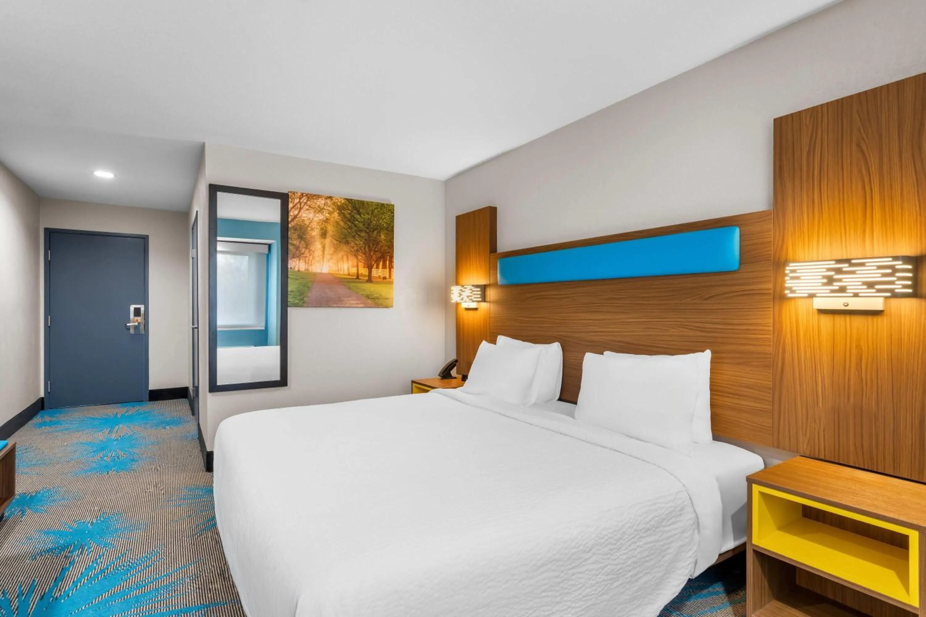 Bed in Days Inn & Suites by Wyndham Brandon Amphitheater