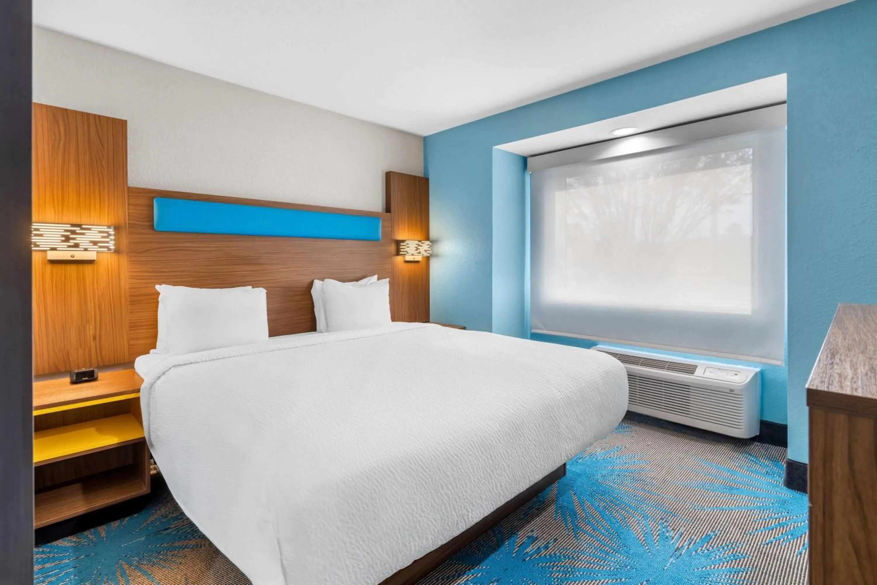 Bed in Days Inn & Suites by Wyndham Brandon Amphitheater