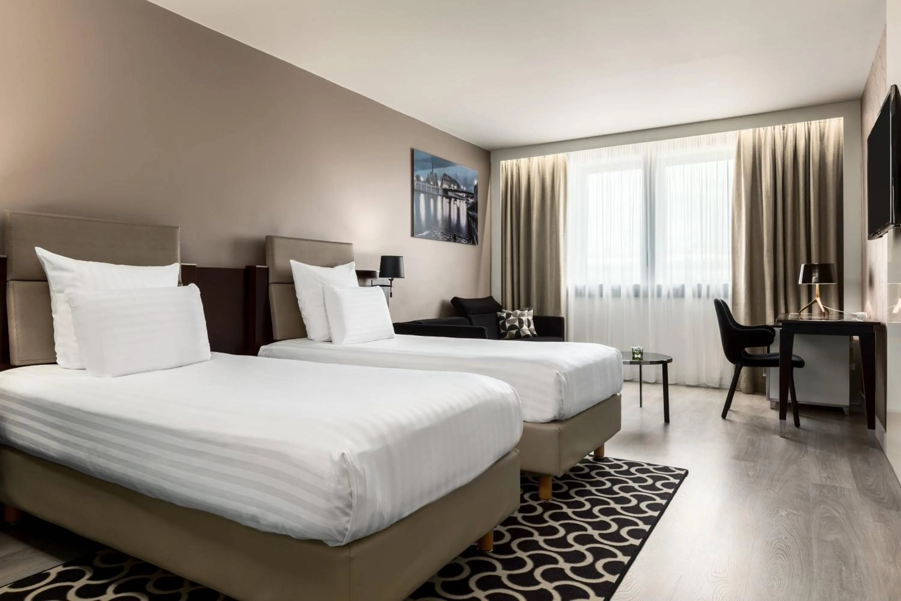 Photo of the whole room, Bed in AC Hotel Paris Porte Maillot by Marriott