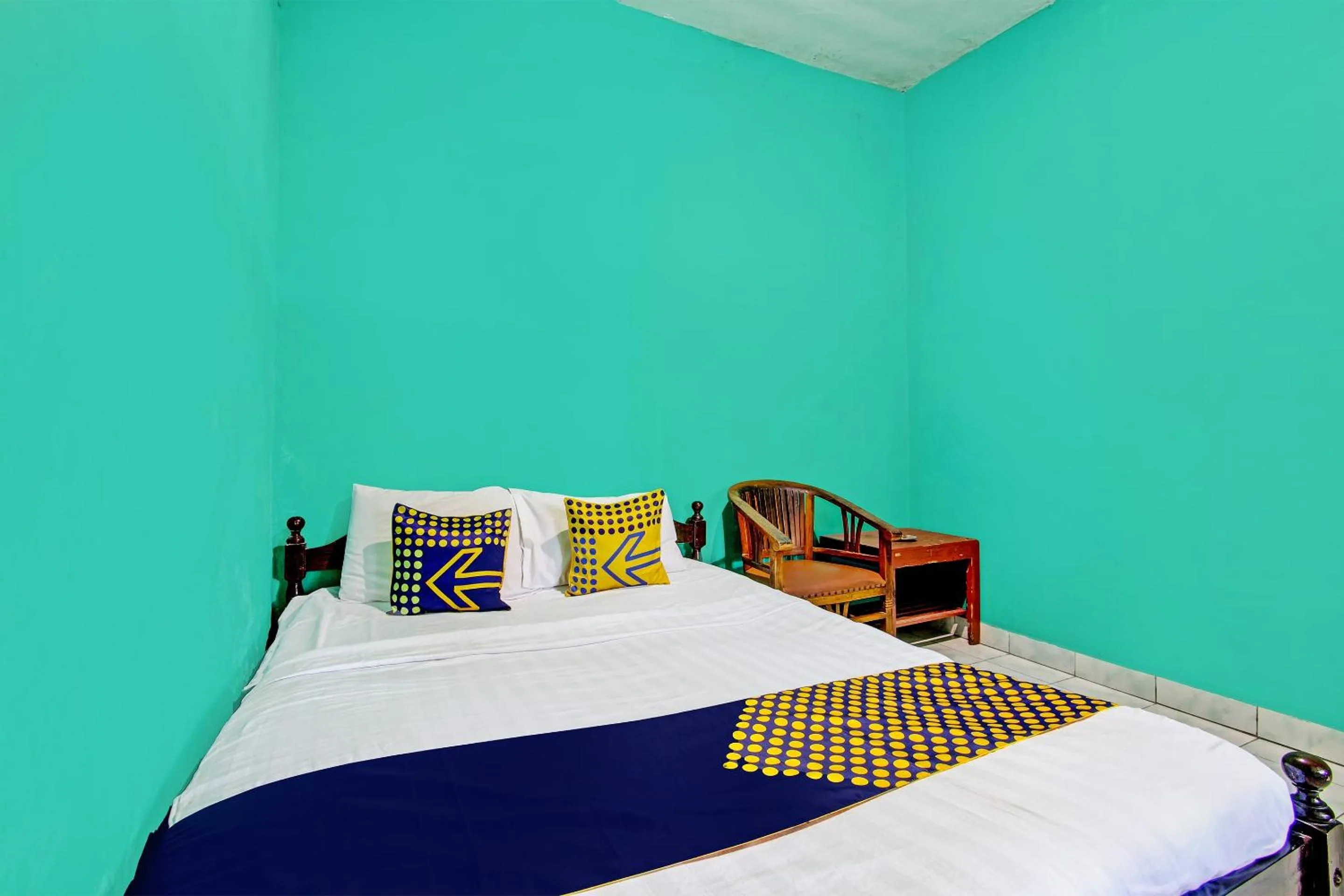 Bedroom in SPOT ON 92873 Losmen Parikesit