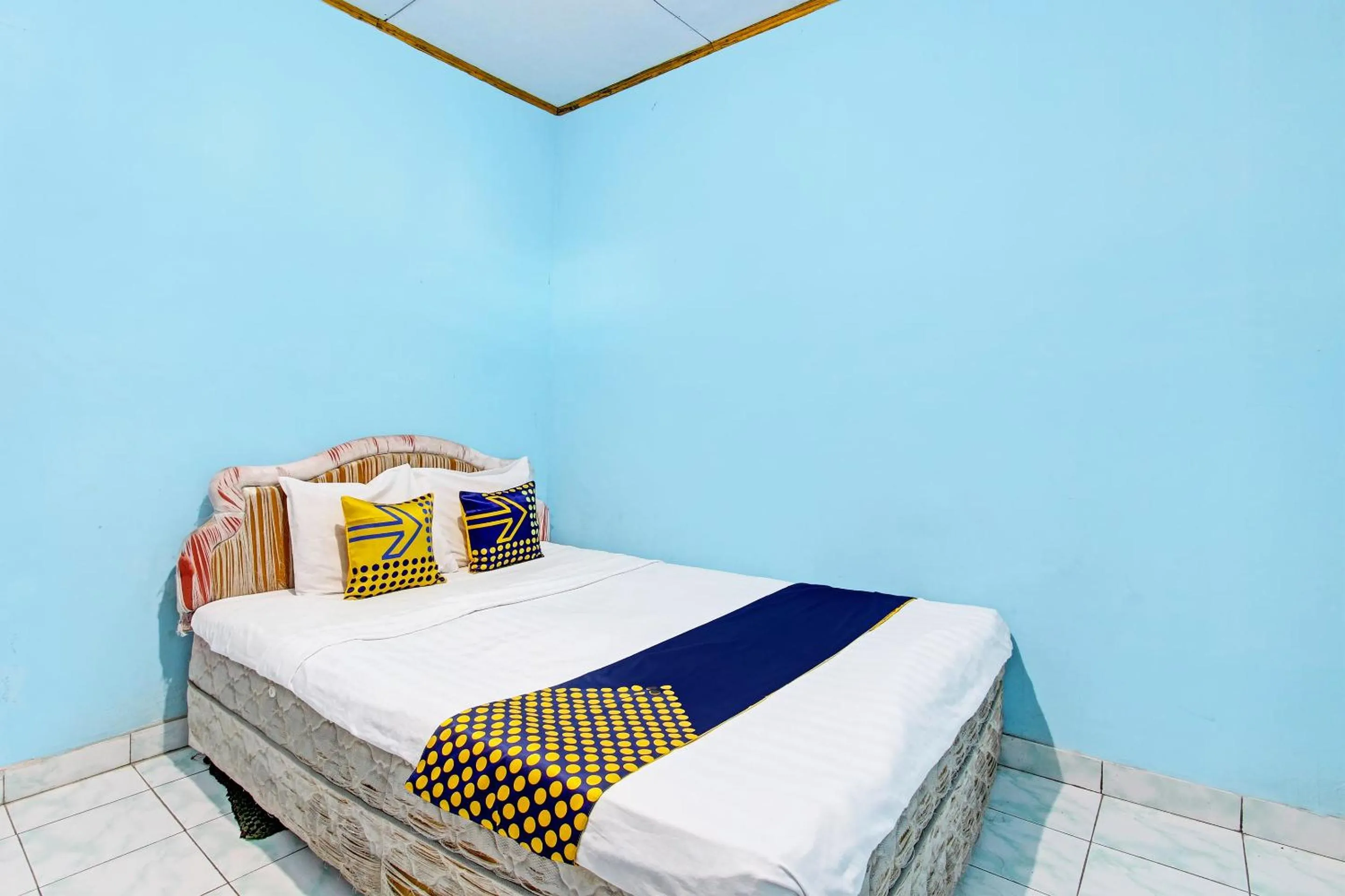 Bedroom in SPOT ON 92873 Losmen Parikesit