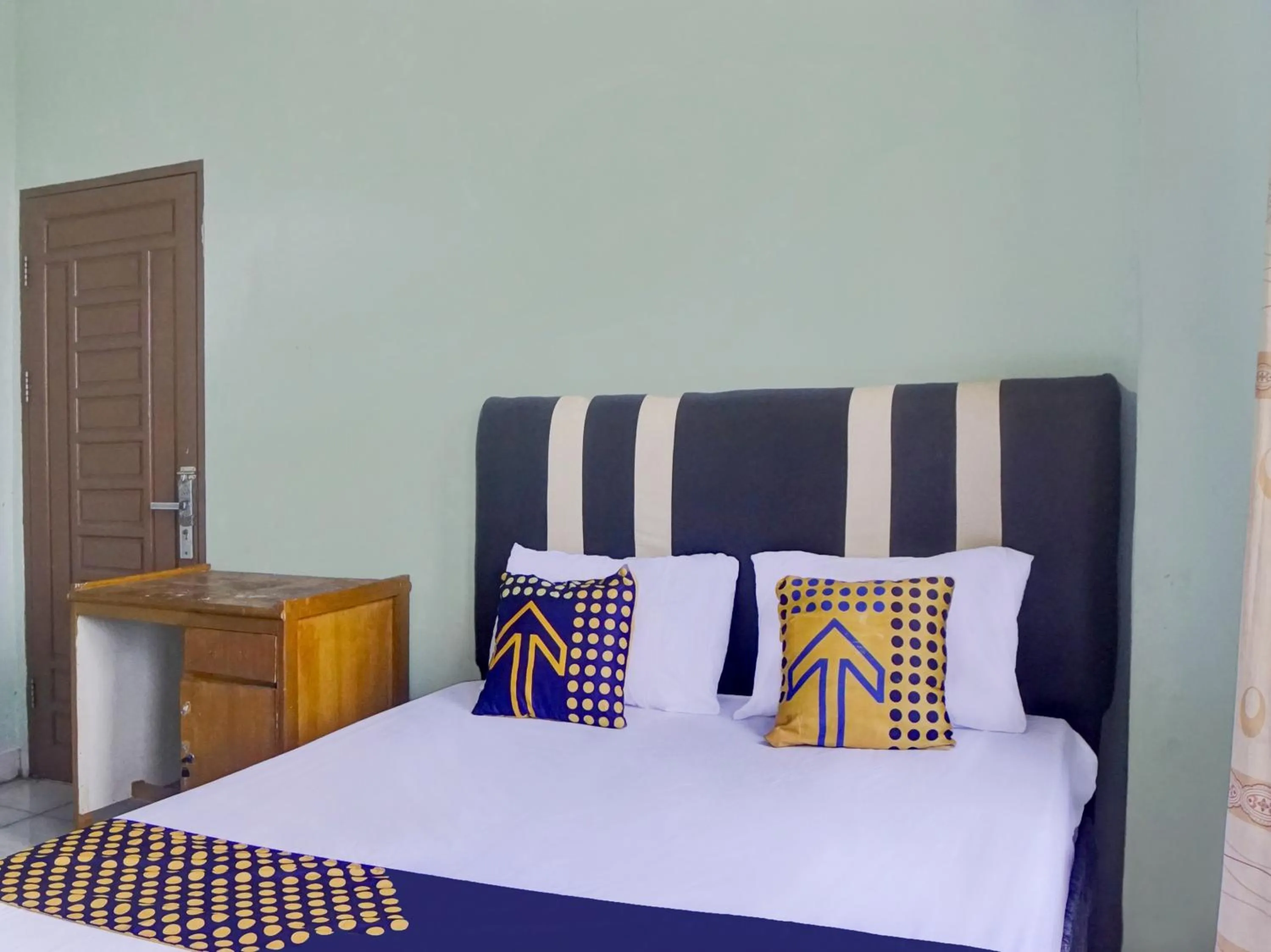 Bedroom, Bed in Hotel O Penginapan Pakam