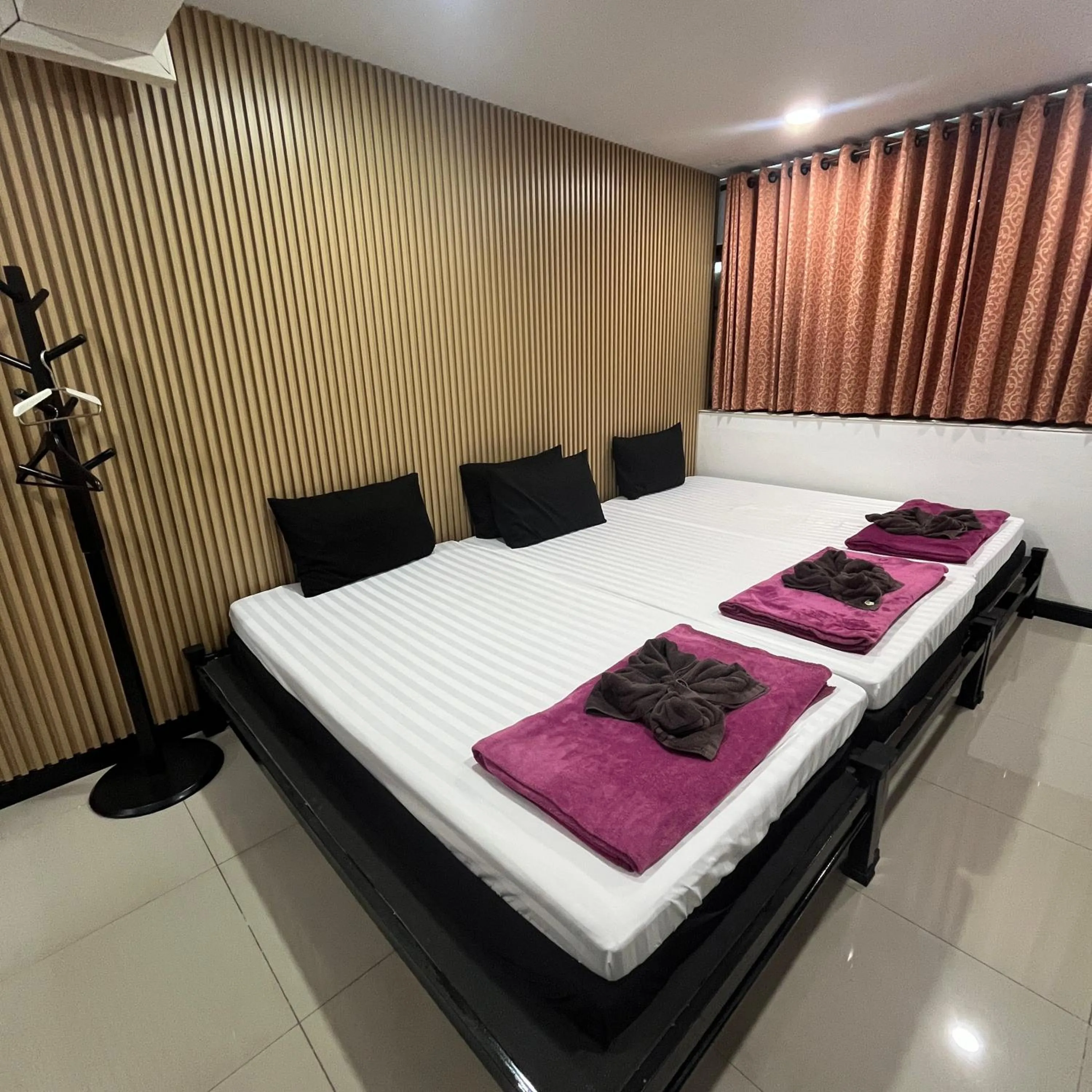 Bed in DonMueang station hotel