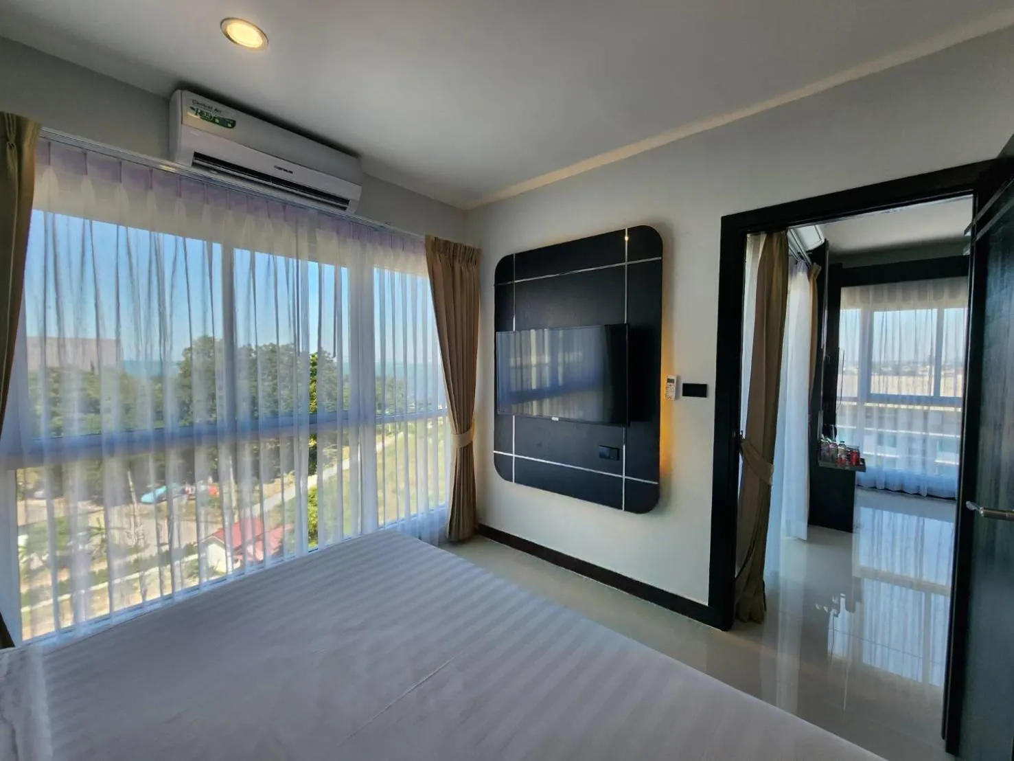 air conditioner, Bed in LHC HOTEL AND RESORT