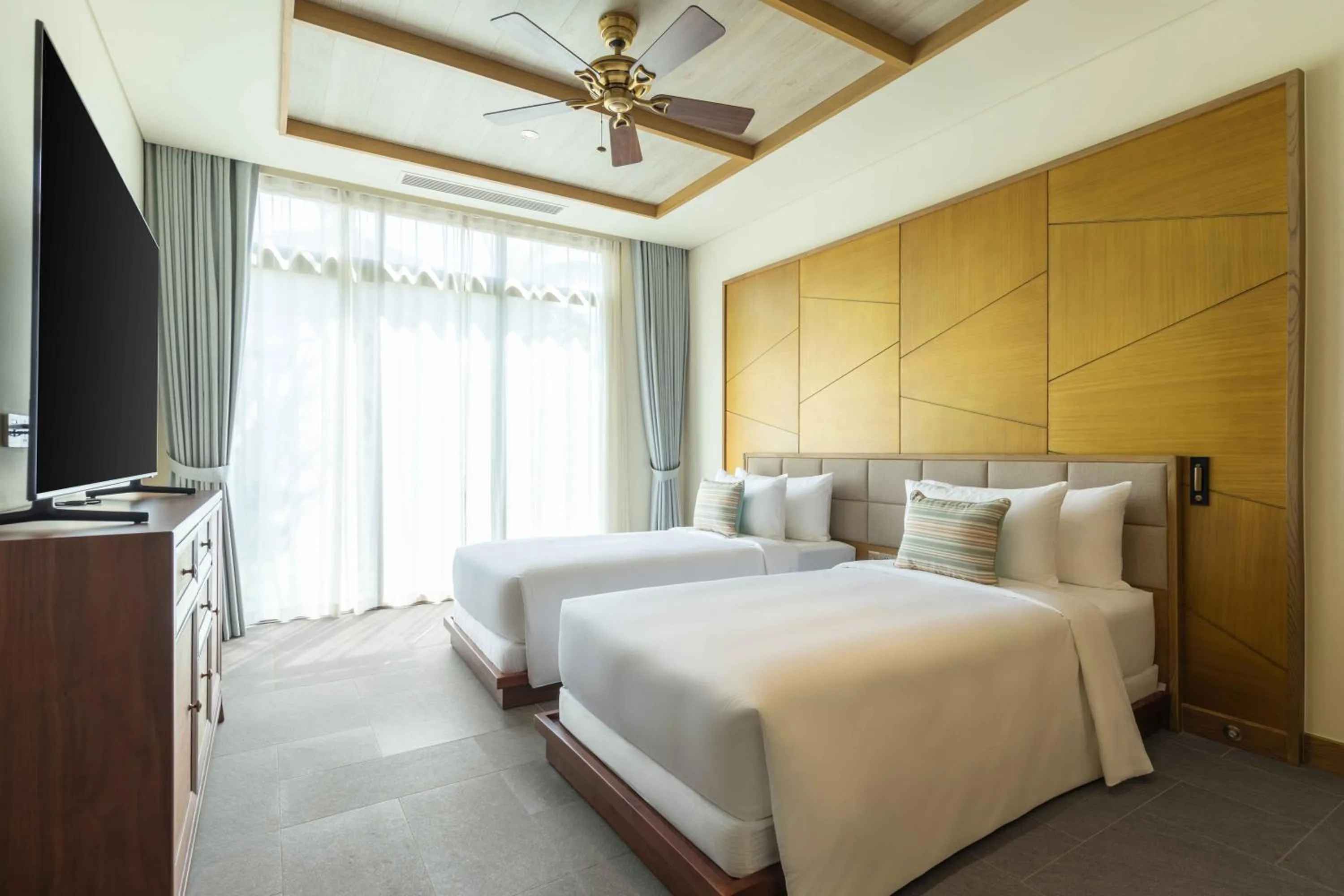 Bed in Fusion Resort and Villas Da Nang