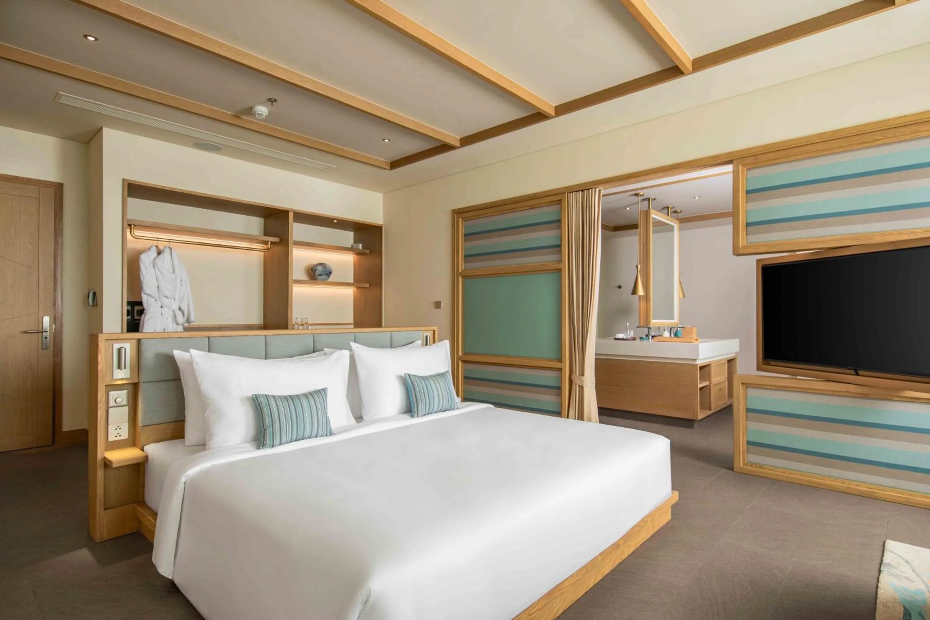 Bed in Fusion Resort and Villas Da Nang