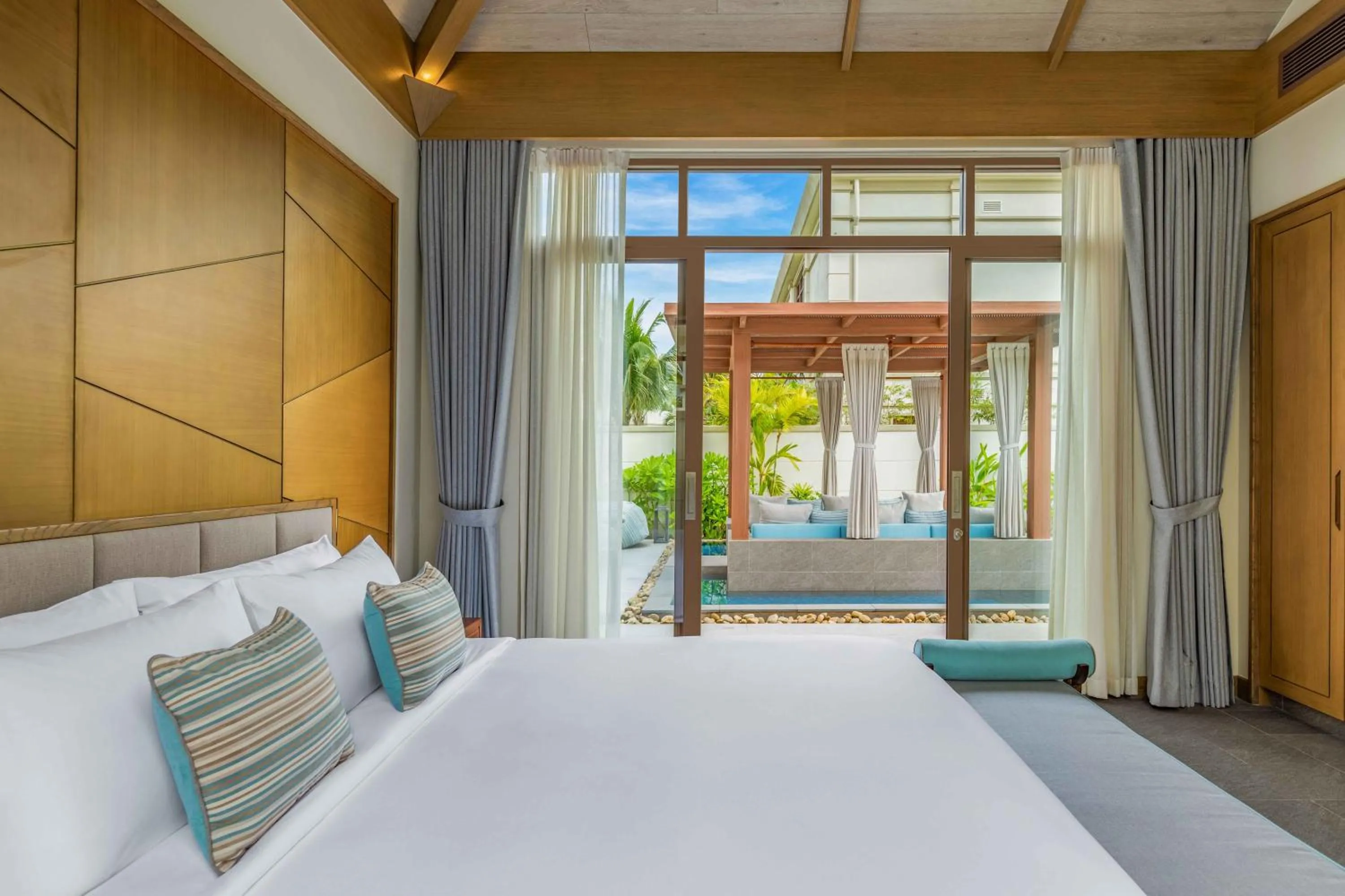 Bed in Fusion Resort and Villas Da Nang
