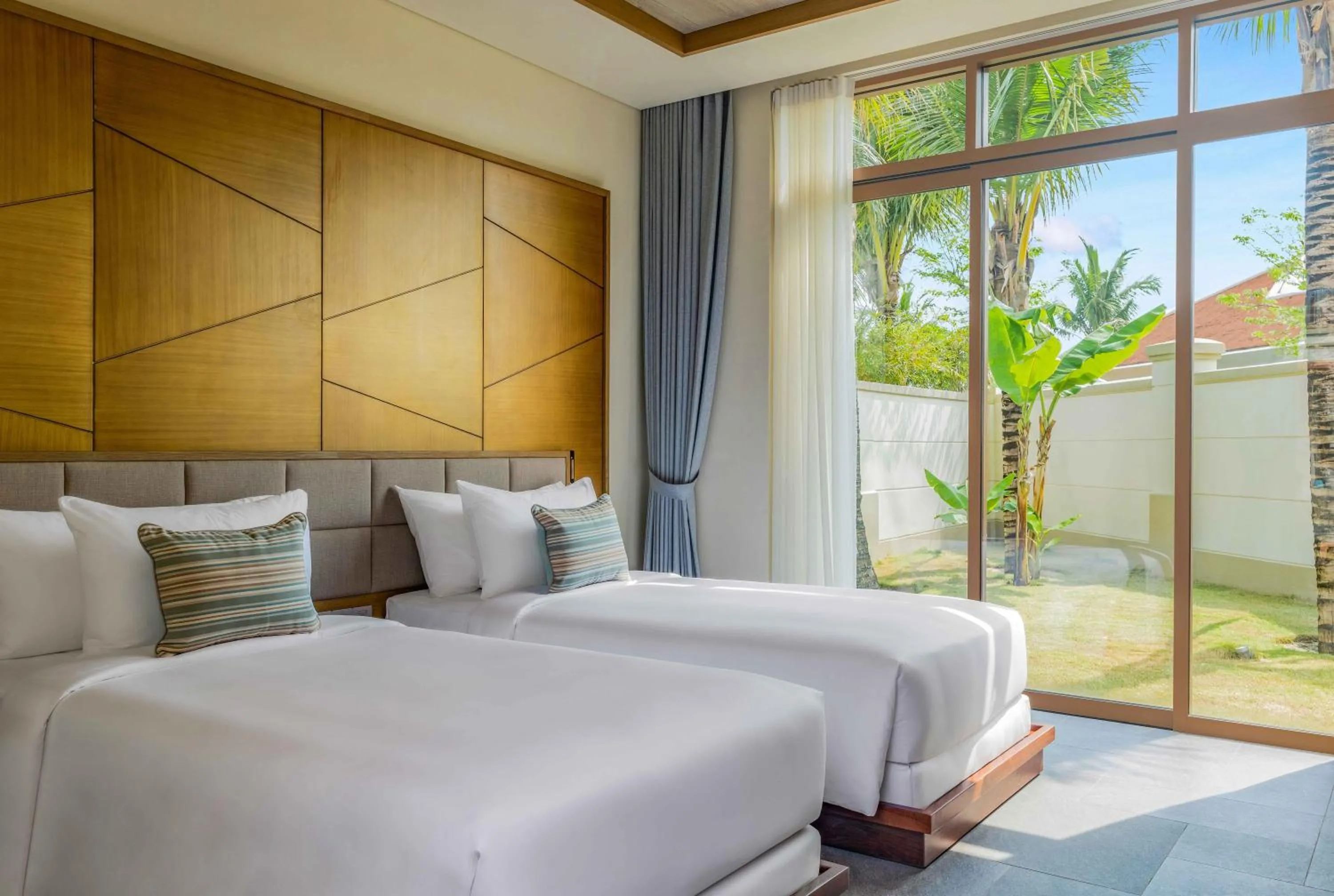 Bed in Fusion Resort and Villas Da Nang