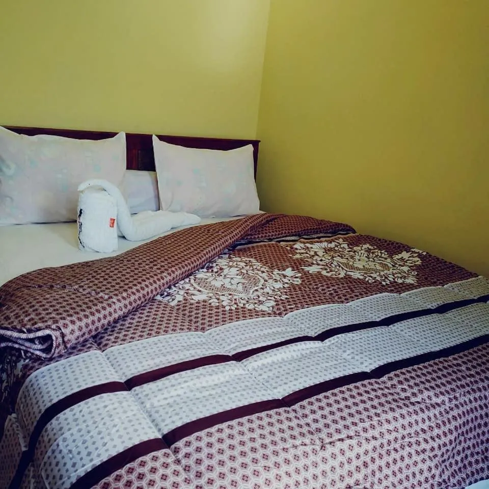 Bed in FIFAWIND HOTEL