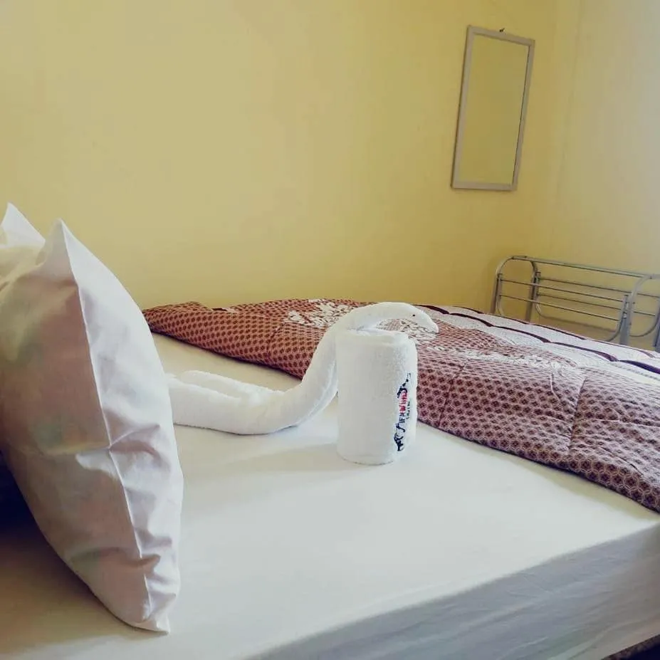 Bed in FIFAWIND HOTEL