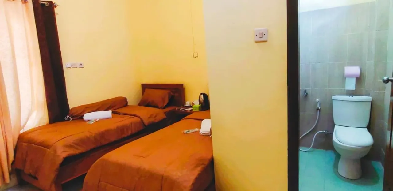 Bed in FIFAWIND HOTEL