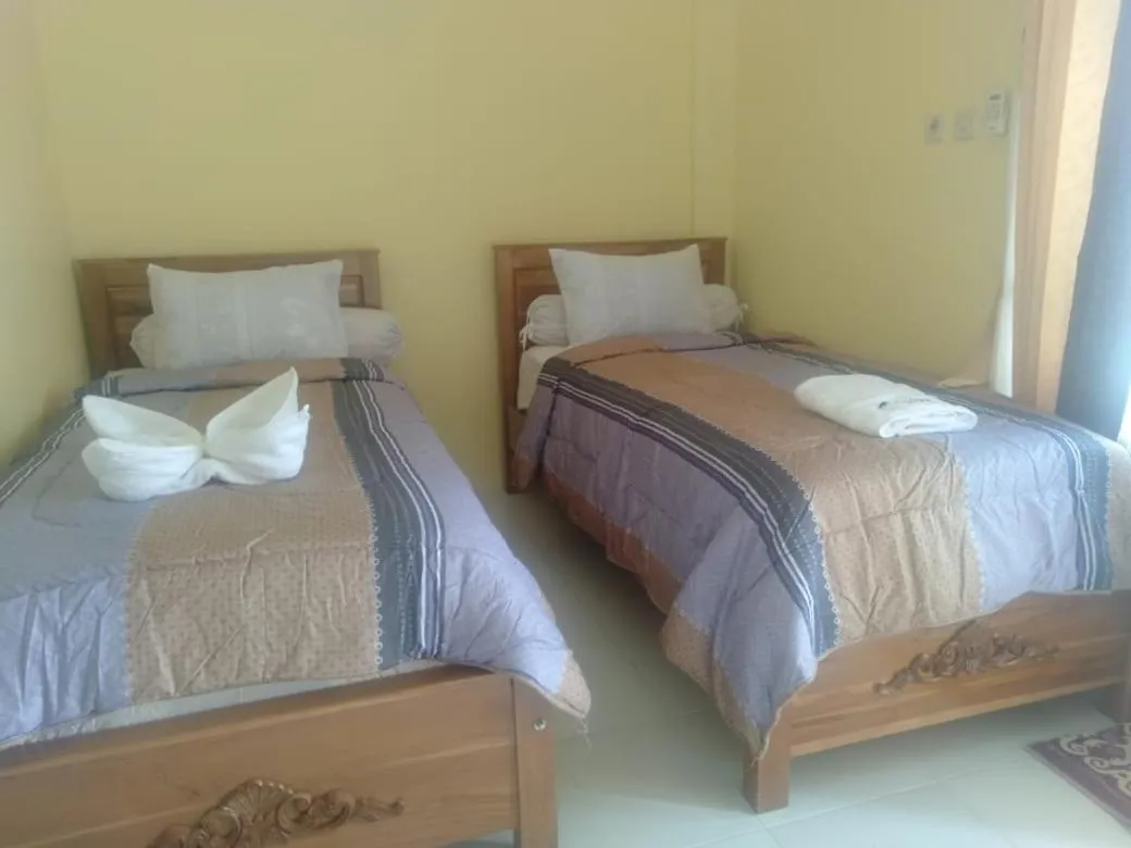 Bed in FIFAWIND HOTEL