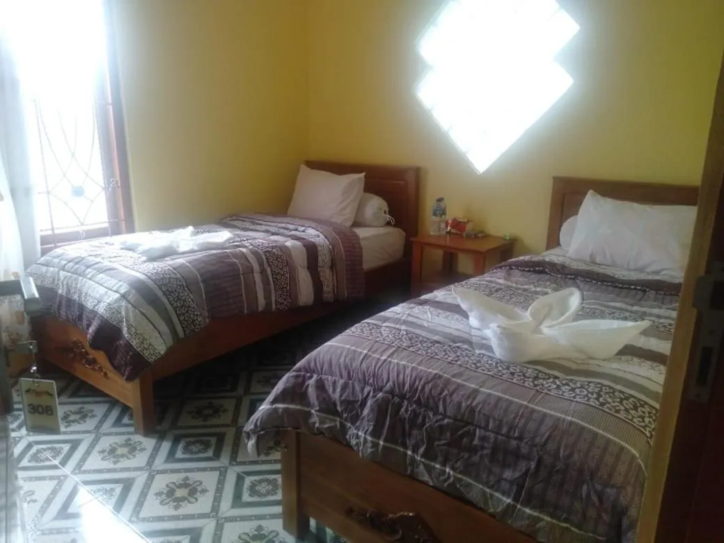 Bed in FIFAWIND HOTEL