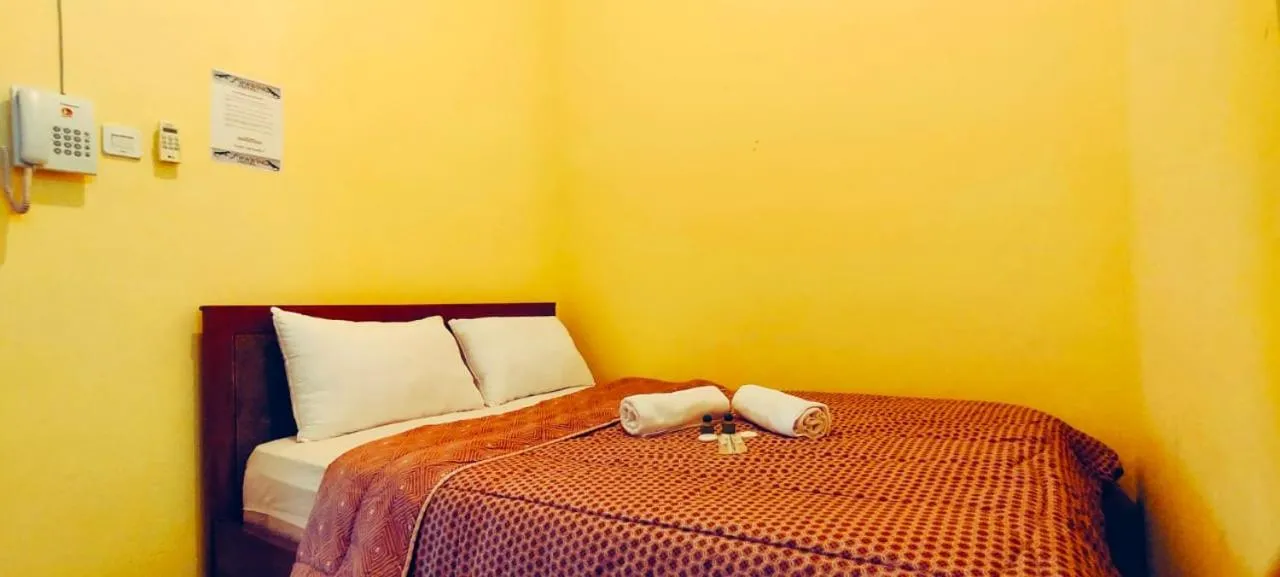 Bed in FIFAWIND HOTEL