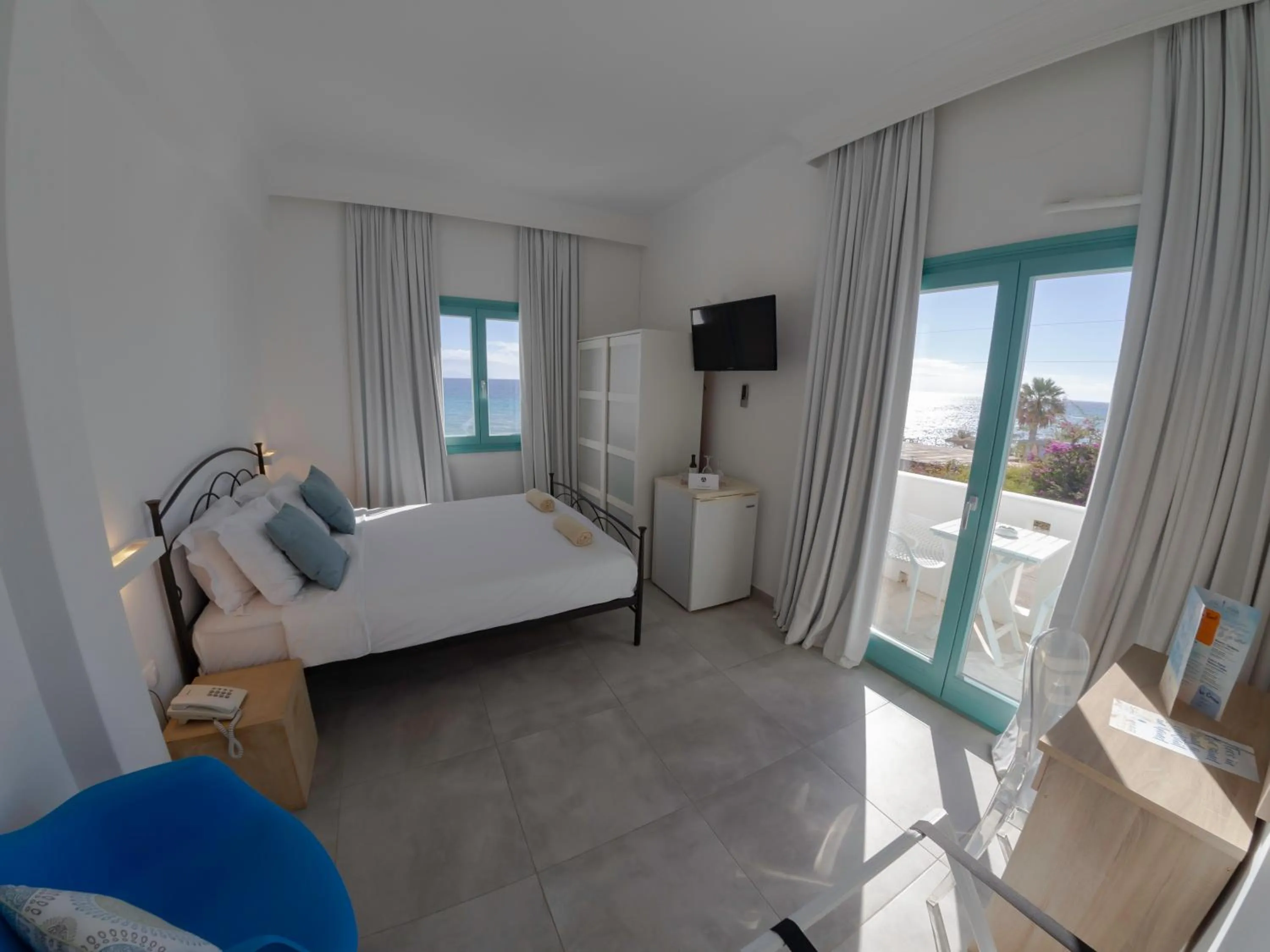 Bed in Amaryllis Beach Hotel