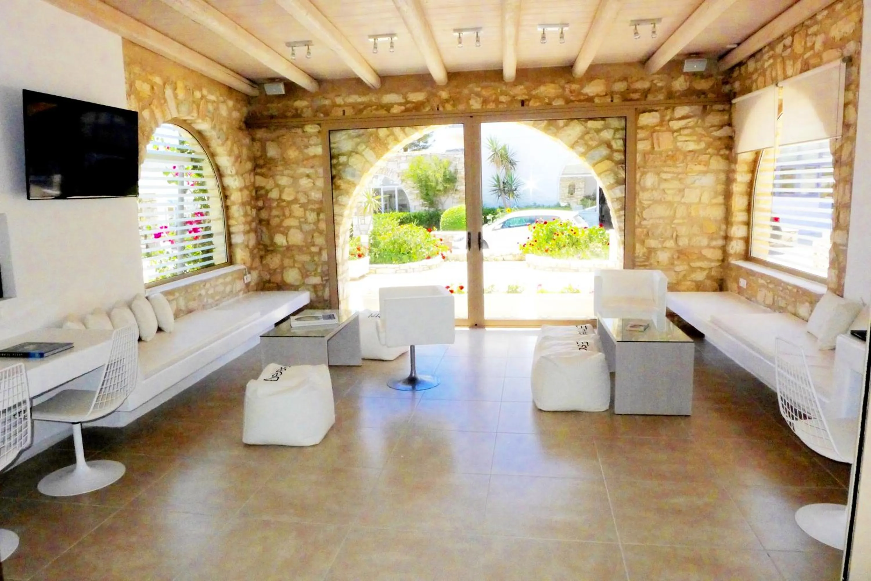 Communal lounge/ TV room in Amaryllis Beach Hotel