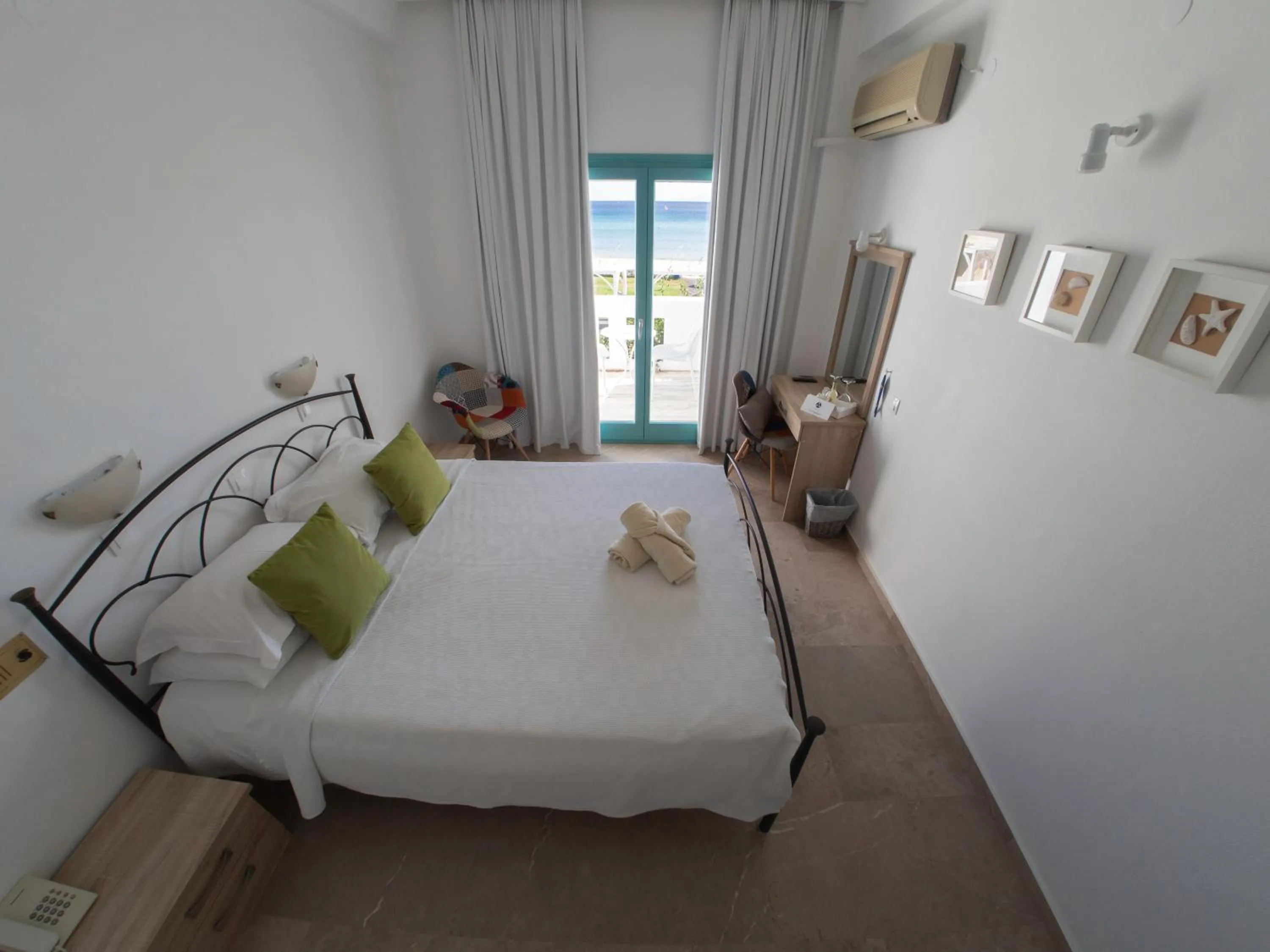 Bed in Amaryllis Beach Hotel