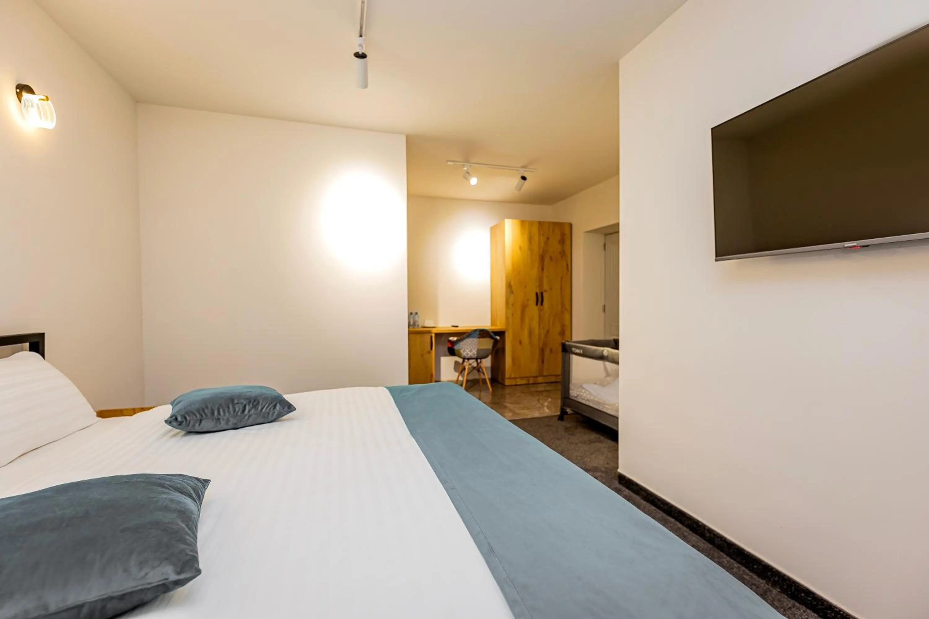 Bed in ARSIS Family Hotel