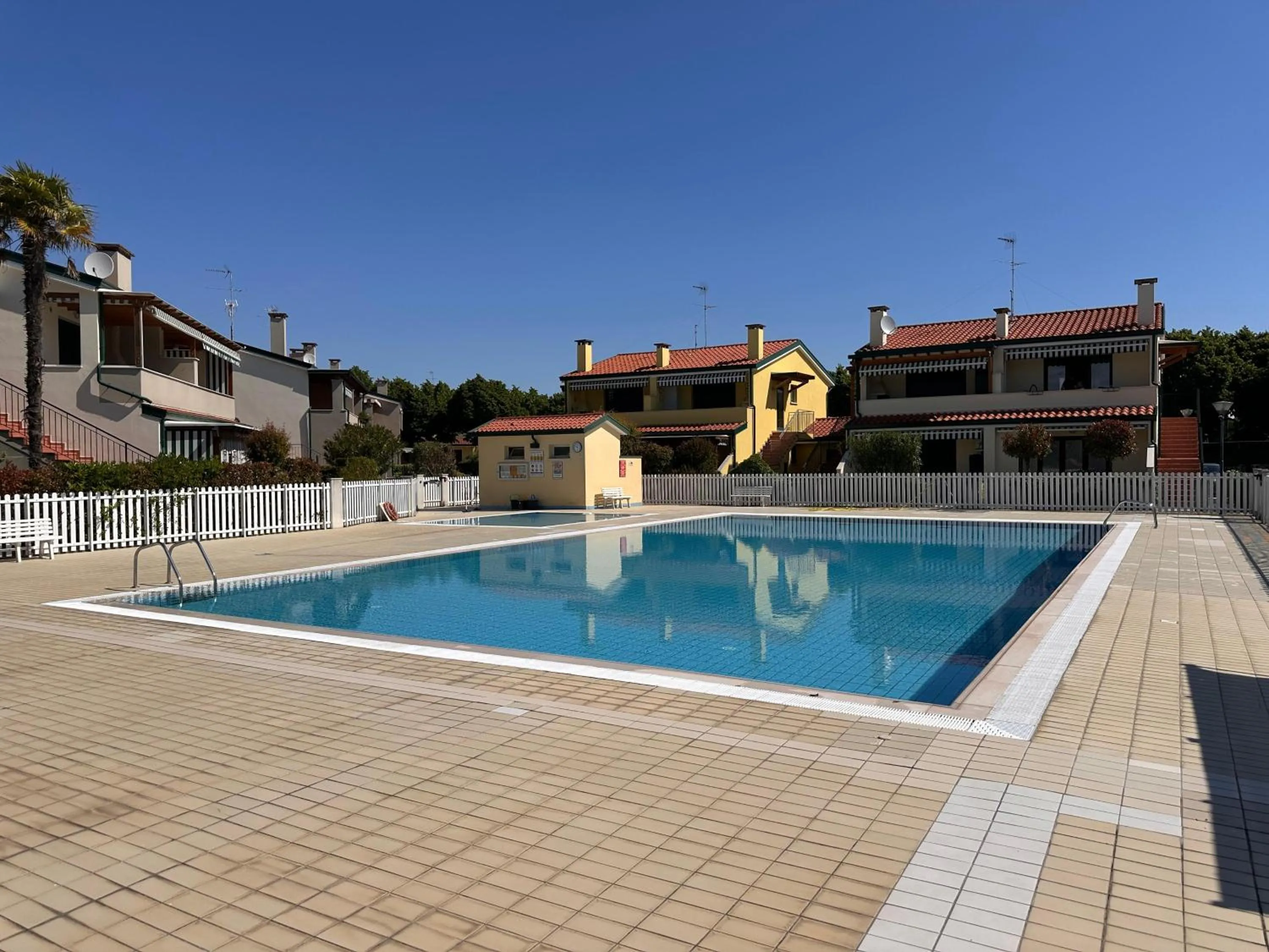 Pool view in Villaggio Cristina 2 - Agenzia Cocal