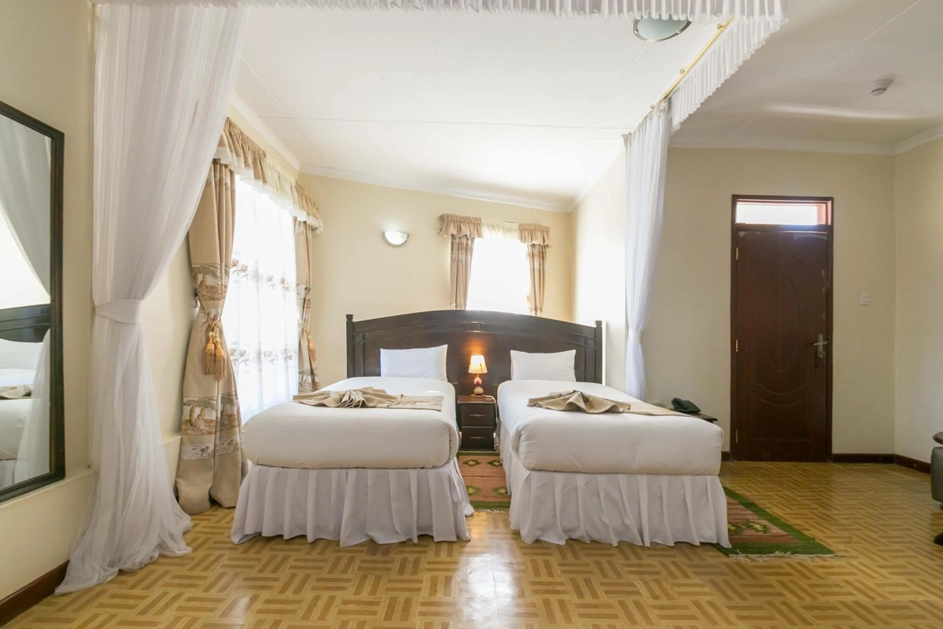 Photo of the whole room, Bed in Fahari Gardens Hotel