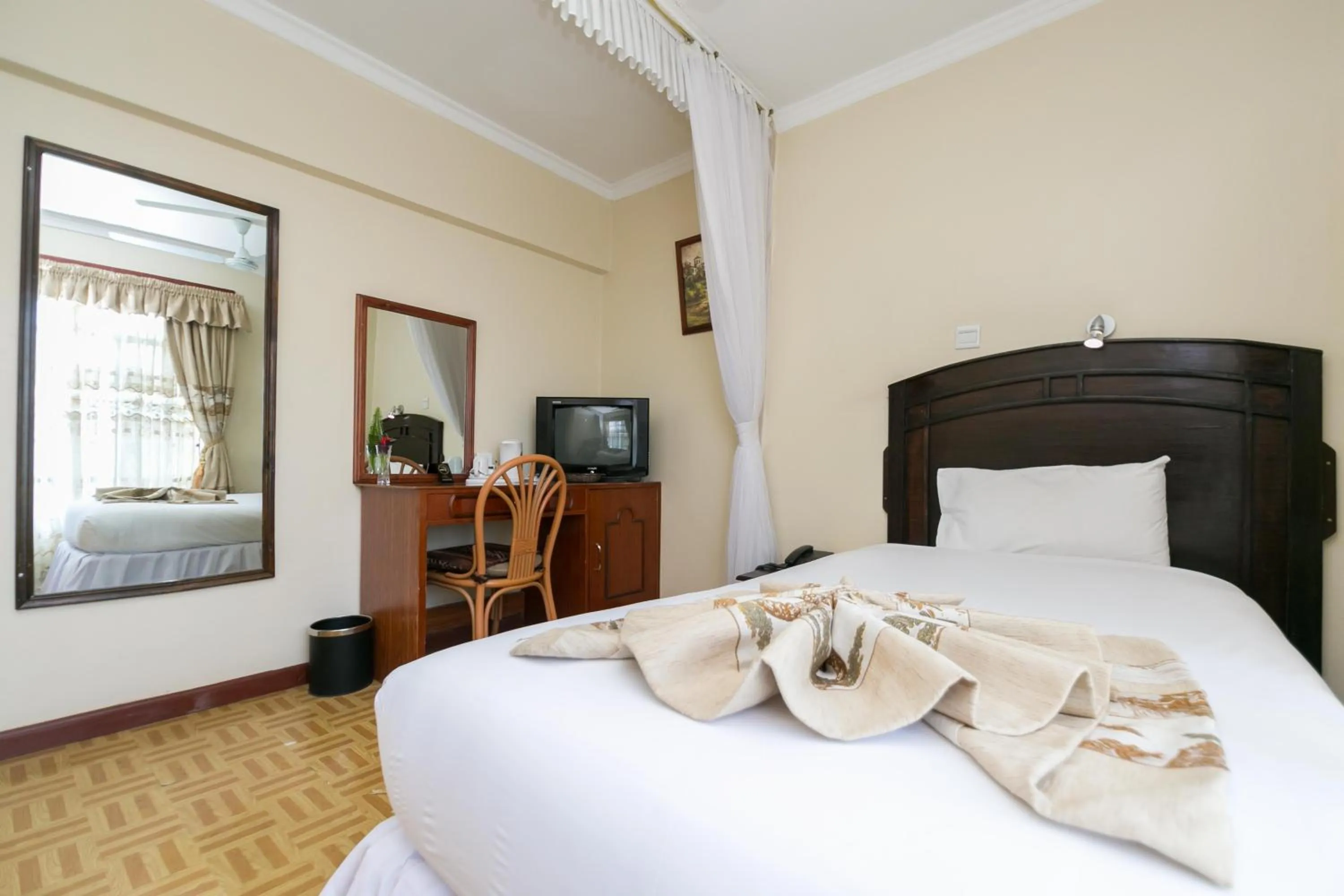 Bed in Fahari Gardens Hotel