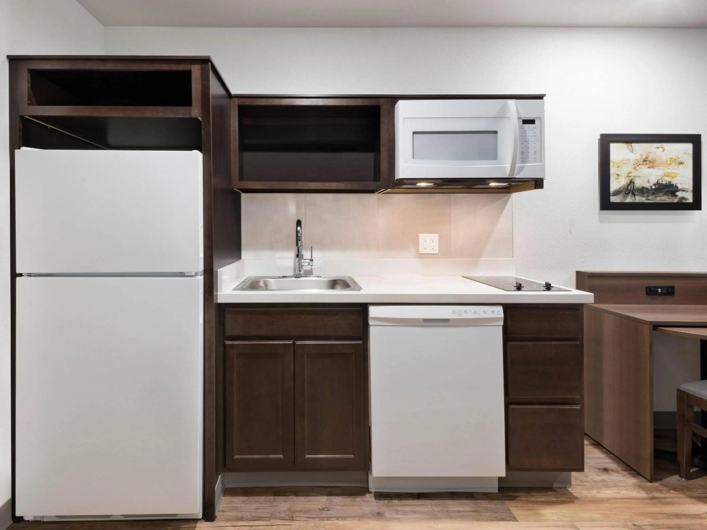 Kitchen or kitchenette in WoodSpring Suites Orlando East UCF