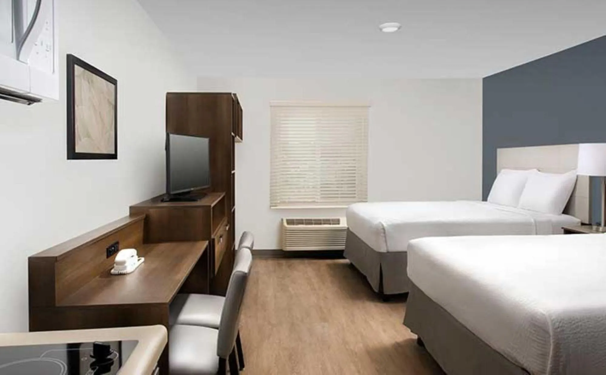 Bed in WoodSpring Suites Orlando East UCF