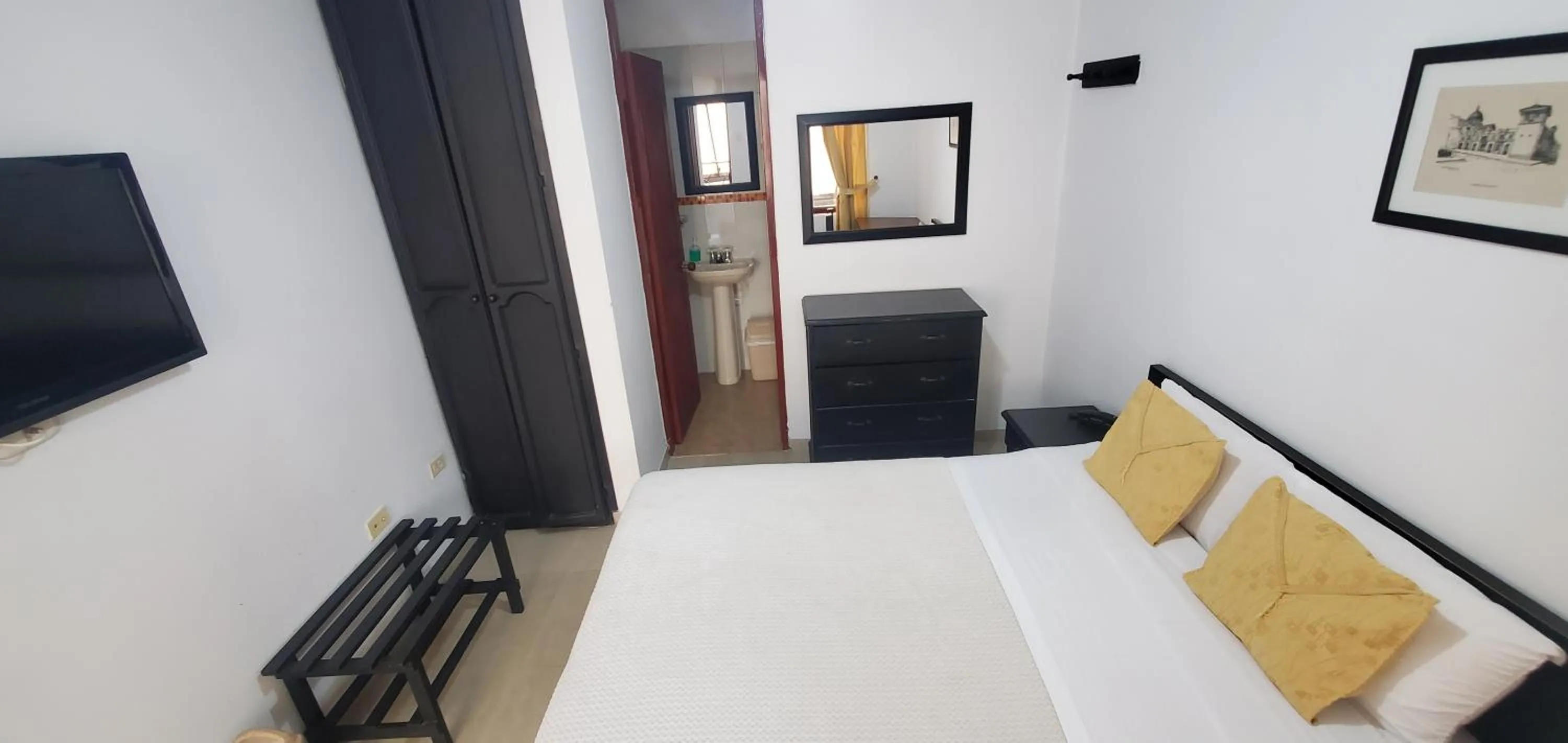 Bed in Hotel Popayan Plaza