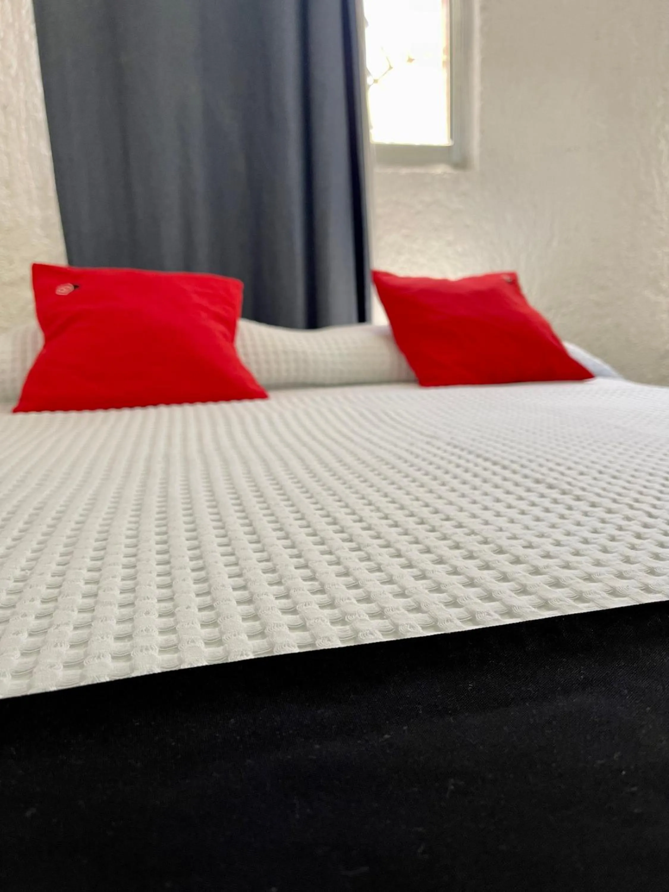 Bed in Hotel Farallon Inn Cancún