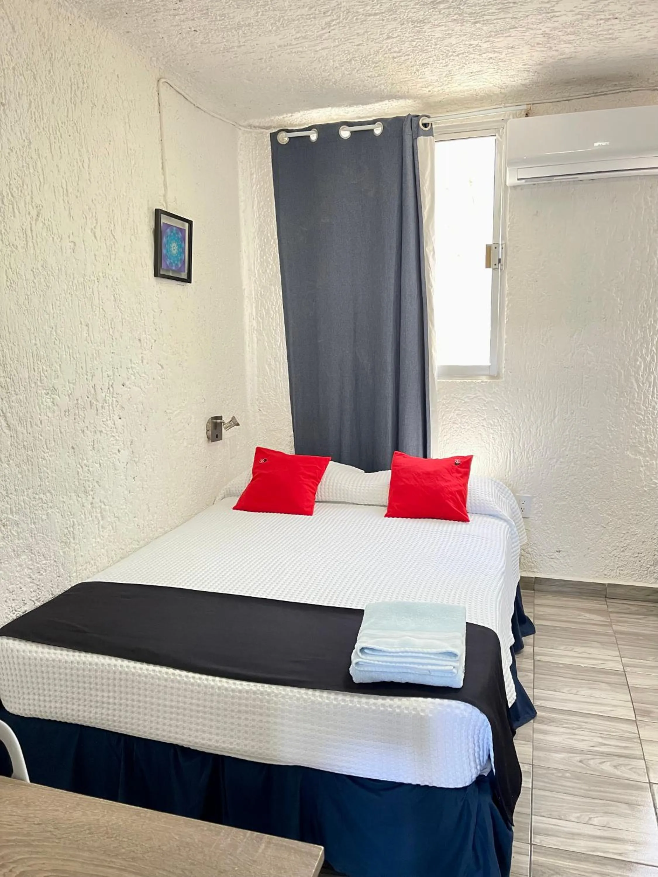 Bed in Hotel Farallon Inn Cancún