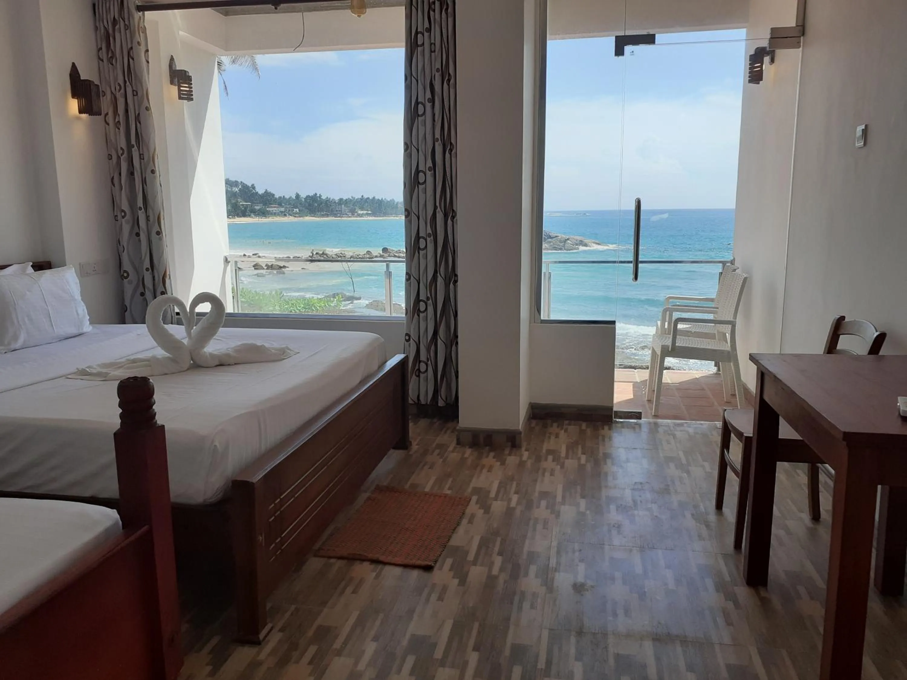 Bed in Coral Beach Hotel