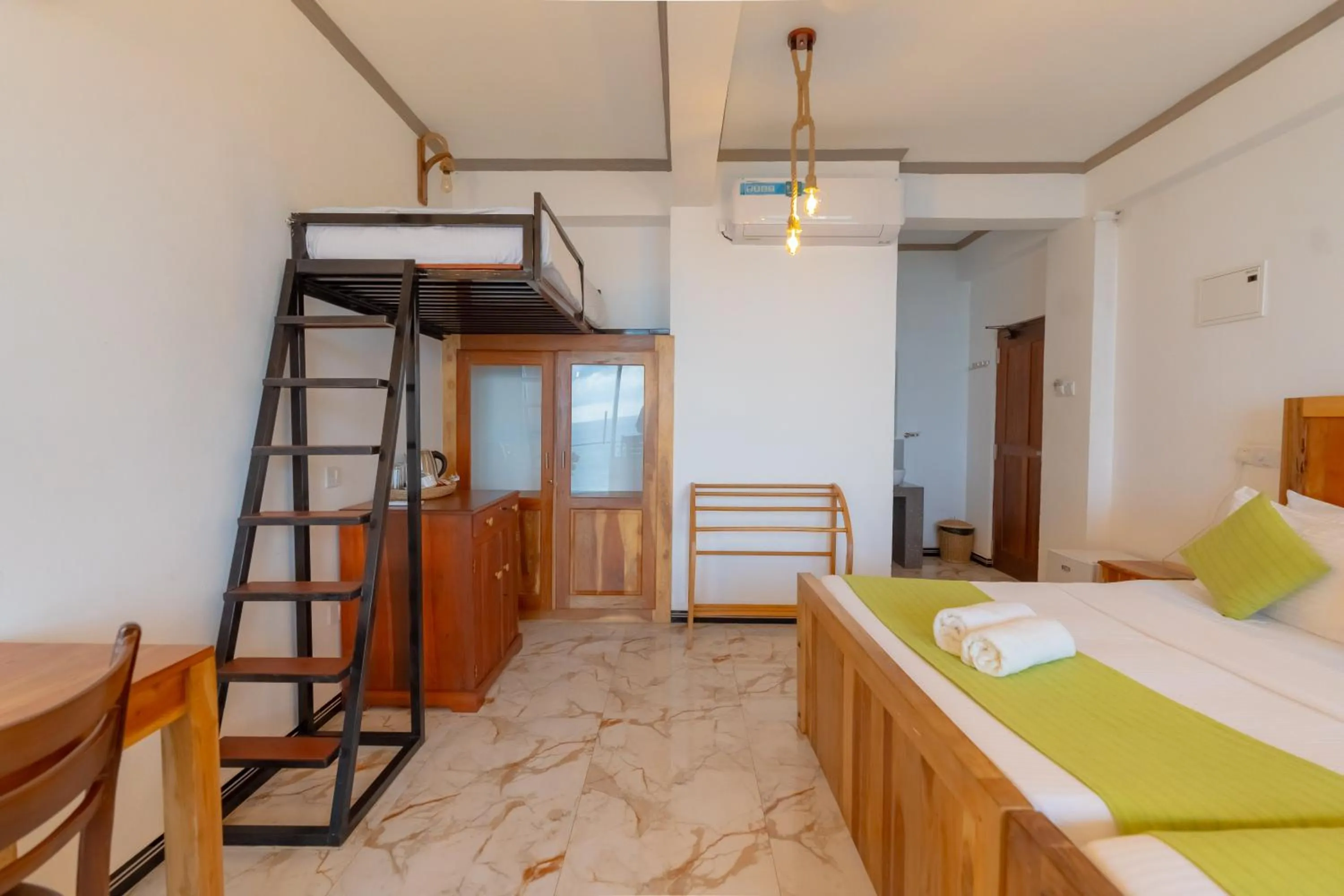 Bed in Coral Beach Hotel