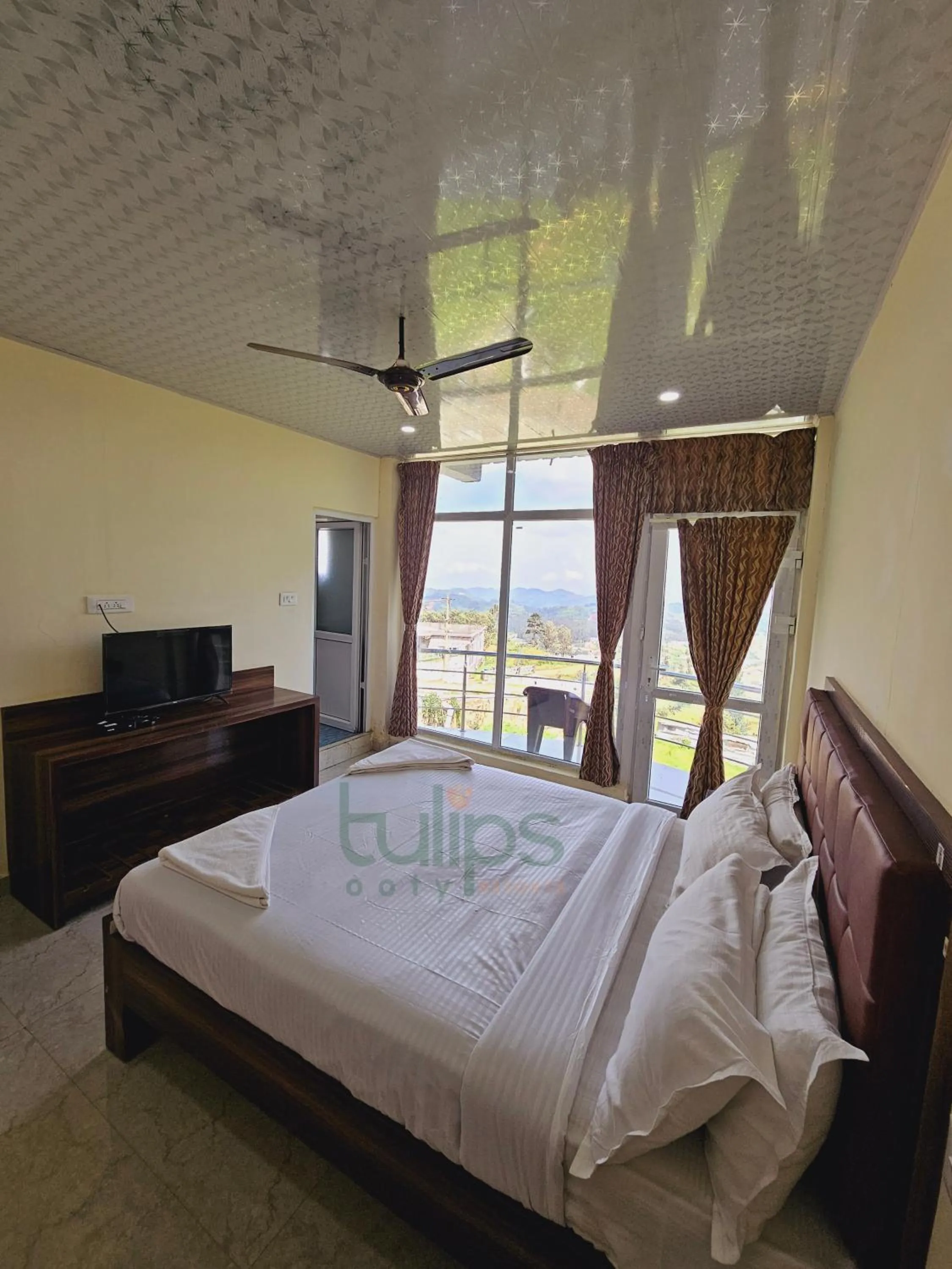 Balcony/Terrace, Bed in Tulips Village Resorts