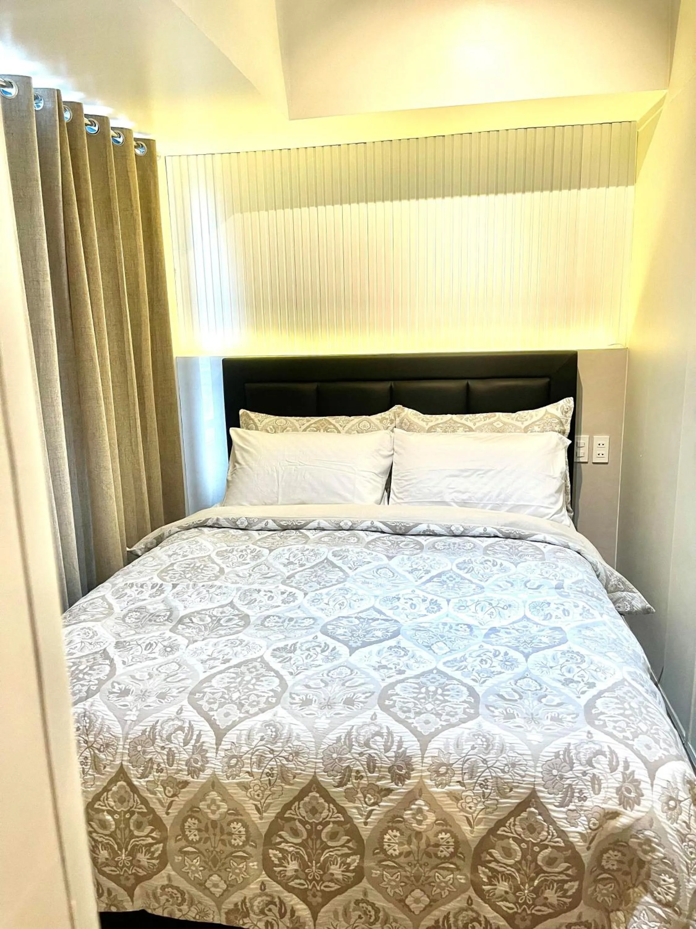 Photo of the whole room, Bed in E & T Homecations 2 Bedroom Apartment at SMDC Air Residences