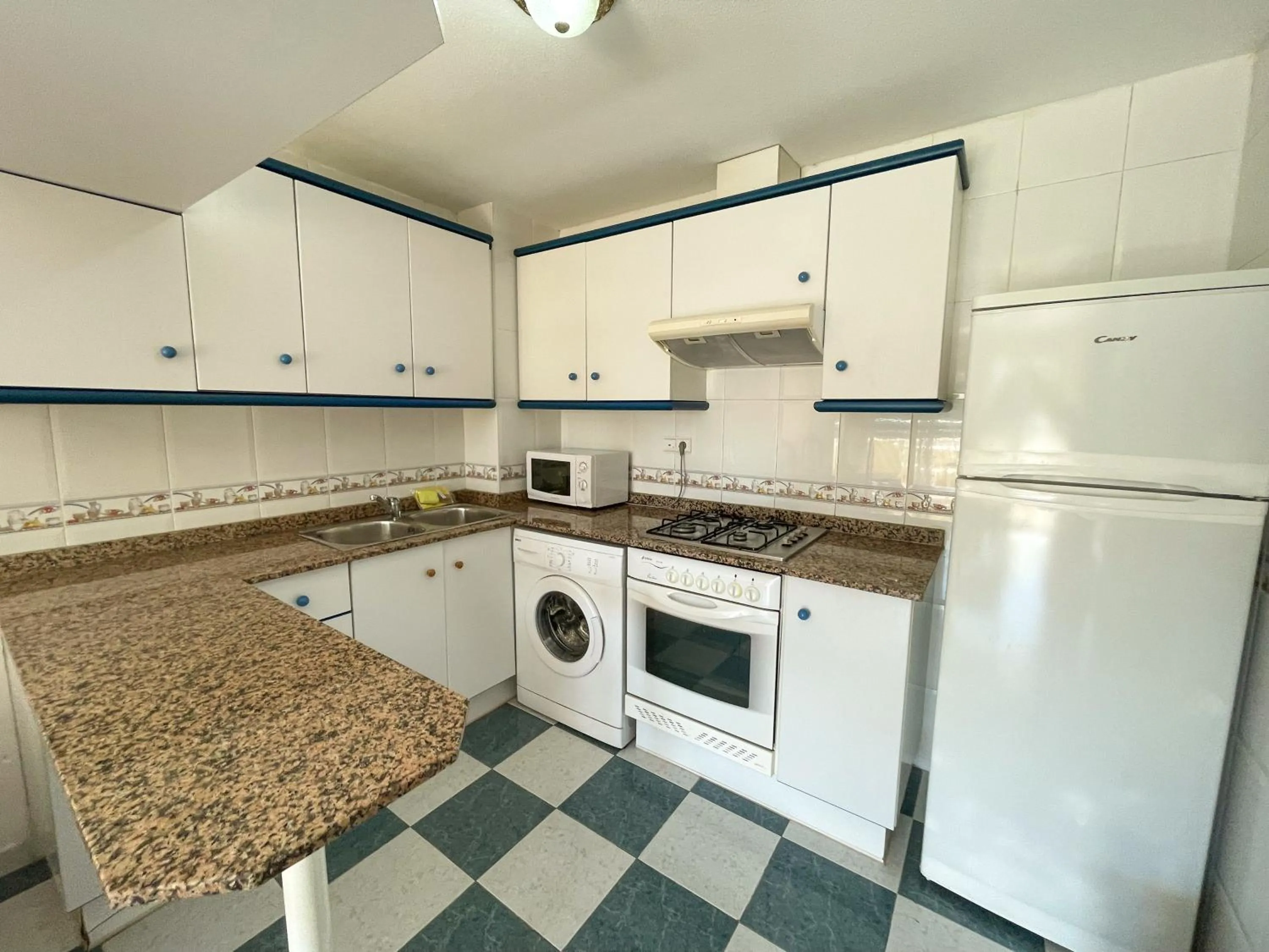 Kitchen or kitchenette in Apartamentos Bonaire 3000