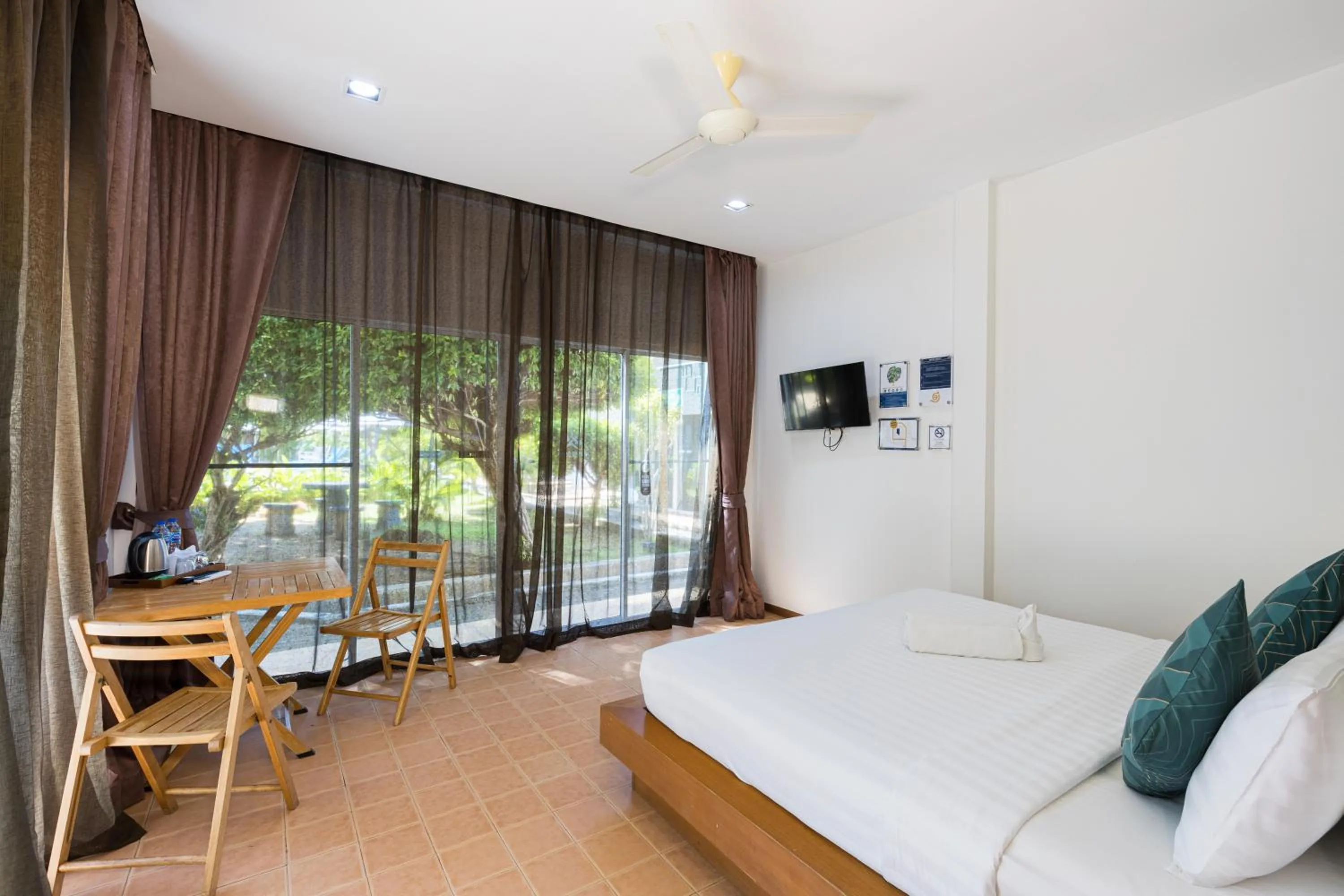 Seating area, Bed in Blue Palm Kata Resort