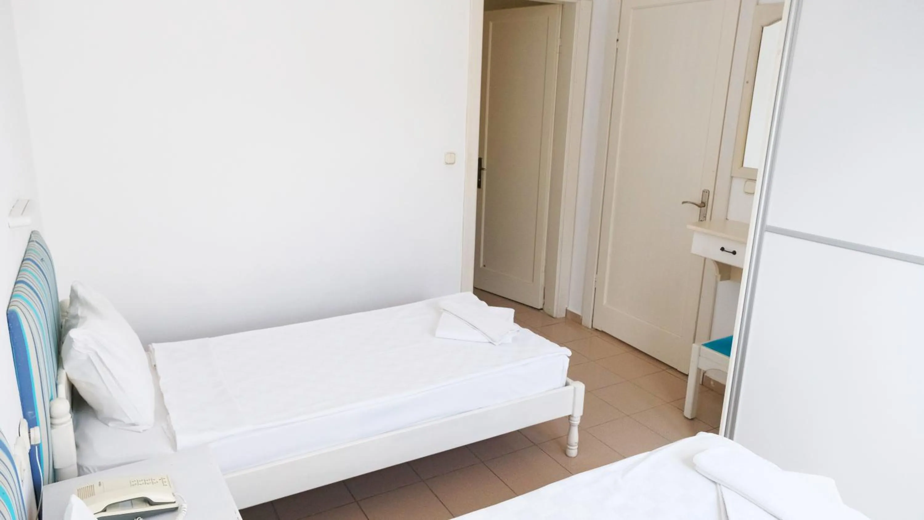 Bed in Gumbet Cove Hotel