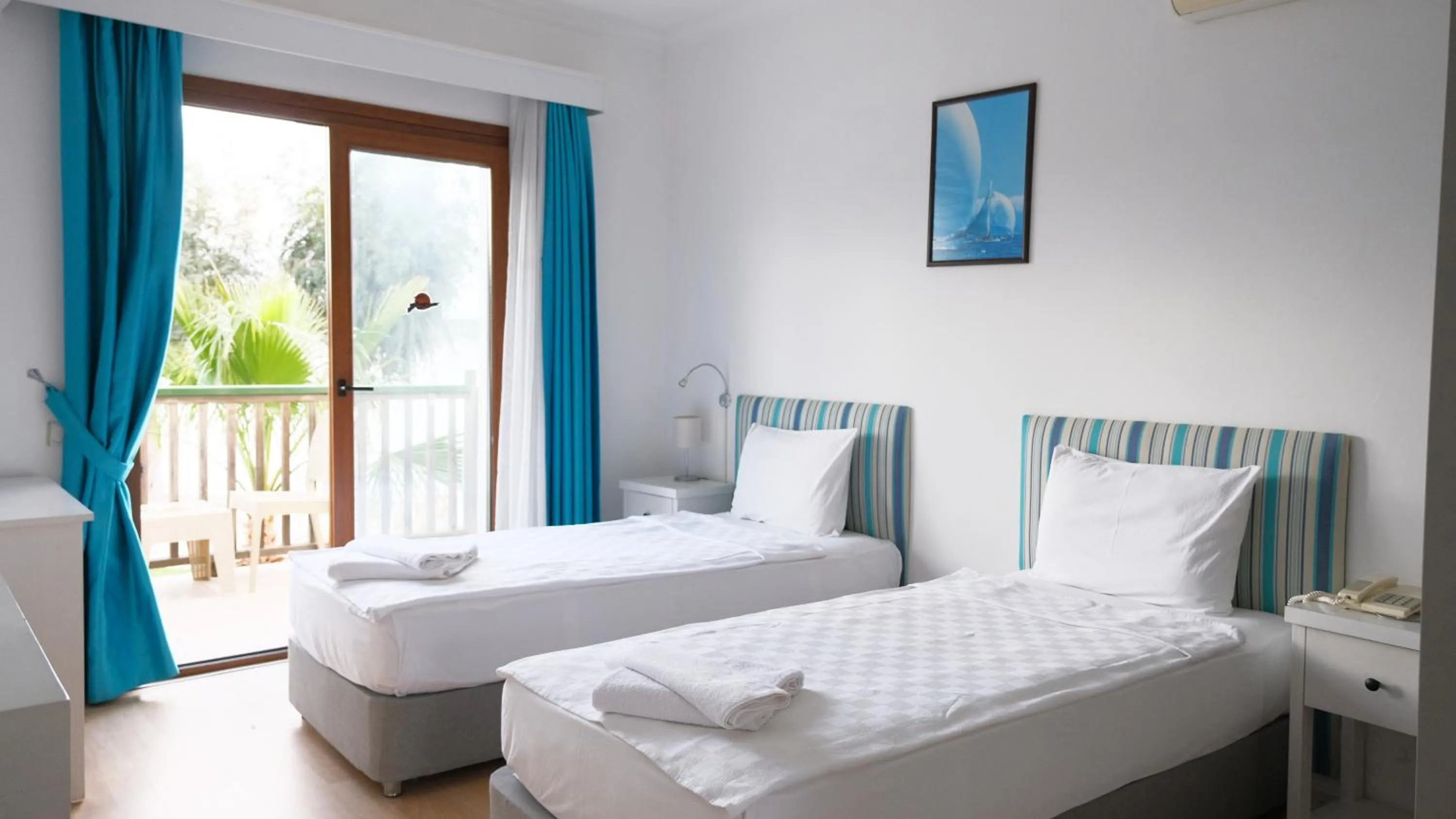 Bed in Gumbet Cove Hotel