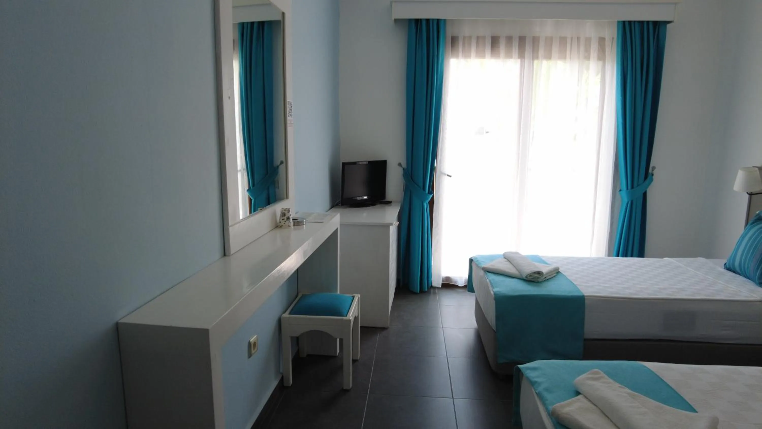 Bed in Gumbet Cove Hotel