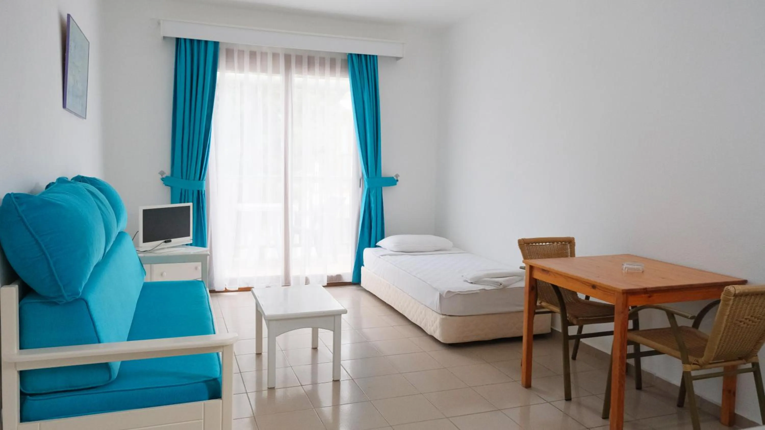 Bed in Gumbet Cove Hotel