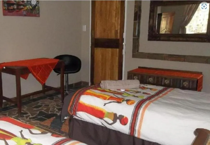 Bed in Emahlathini Guest Farm