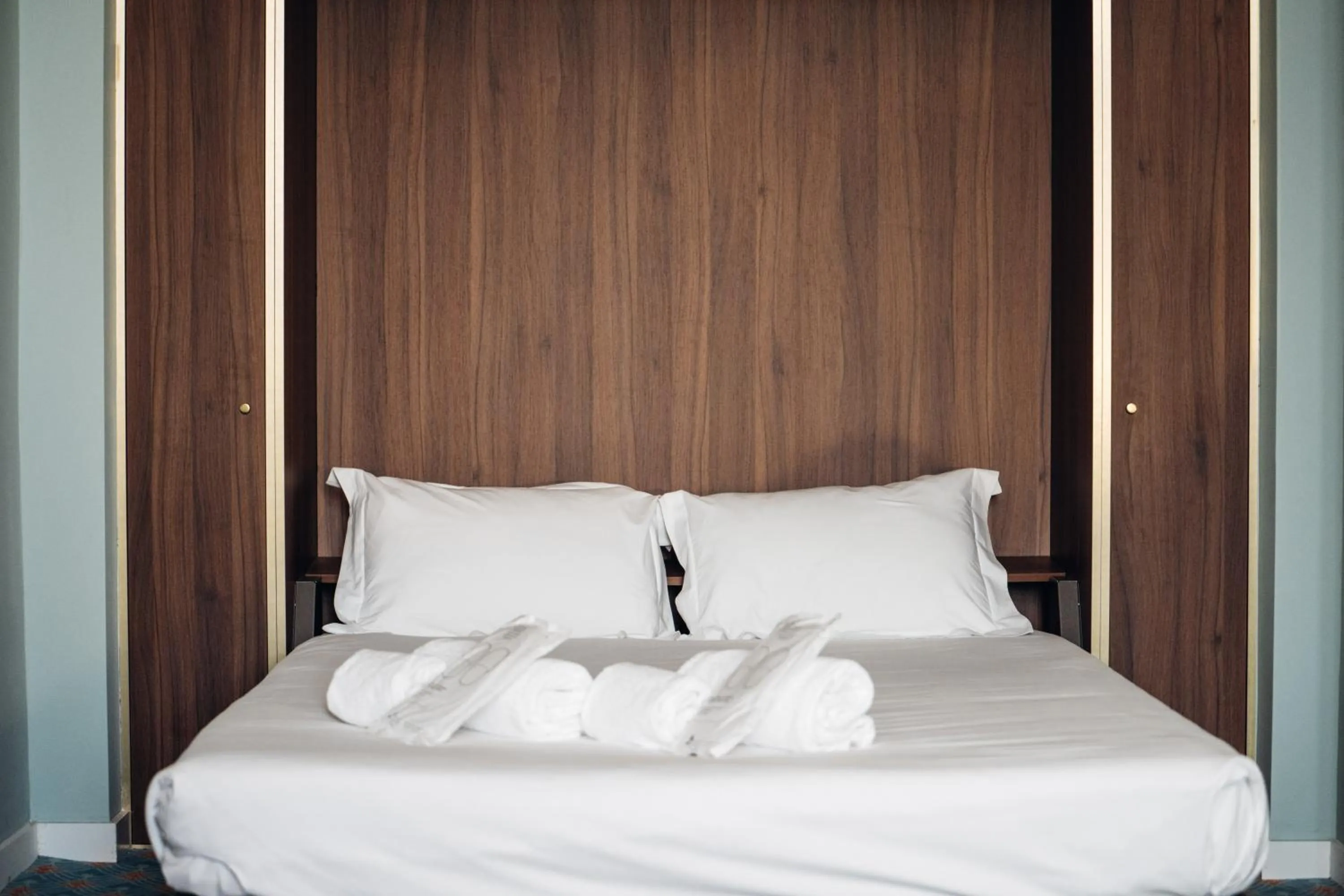 Bed in GRANDE HOTEL PARIS by STAY HOTELS