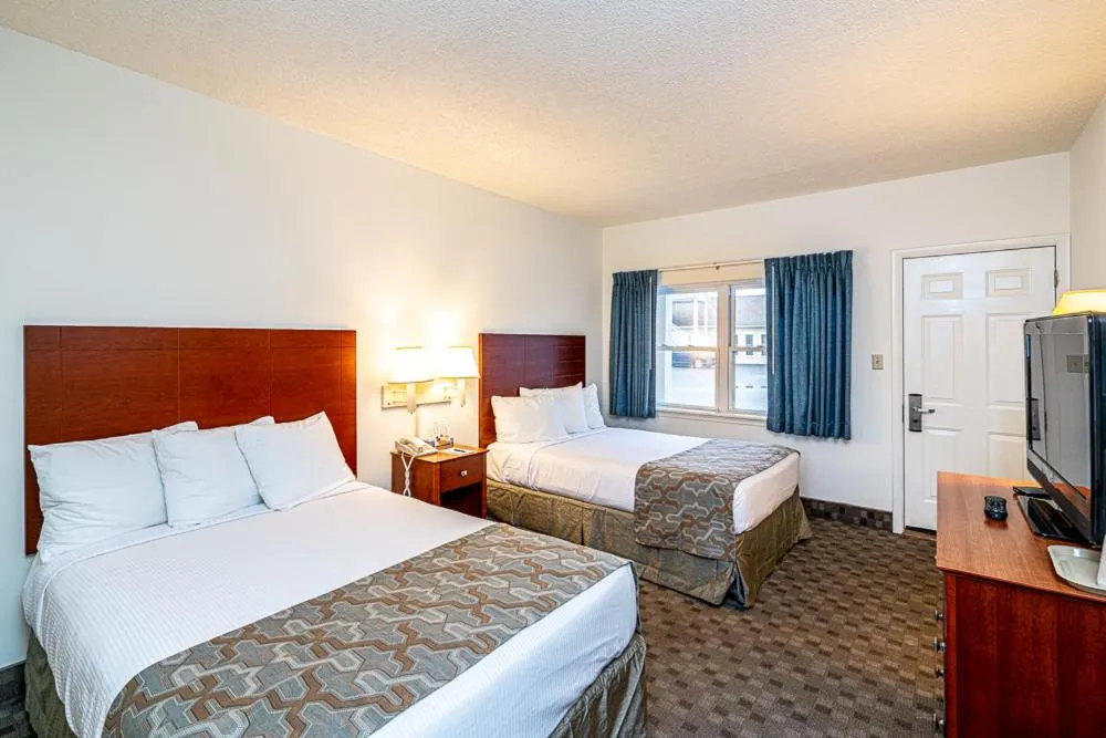 Bed in Anchorage Motel Inc.