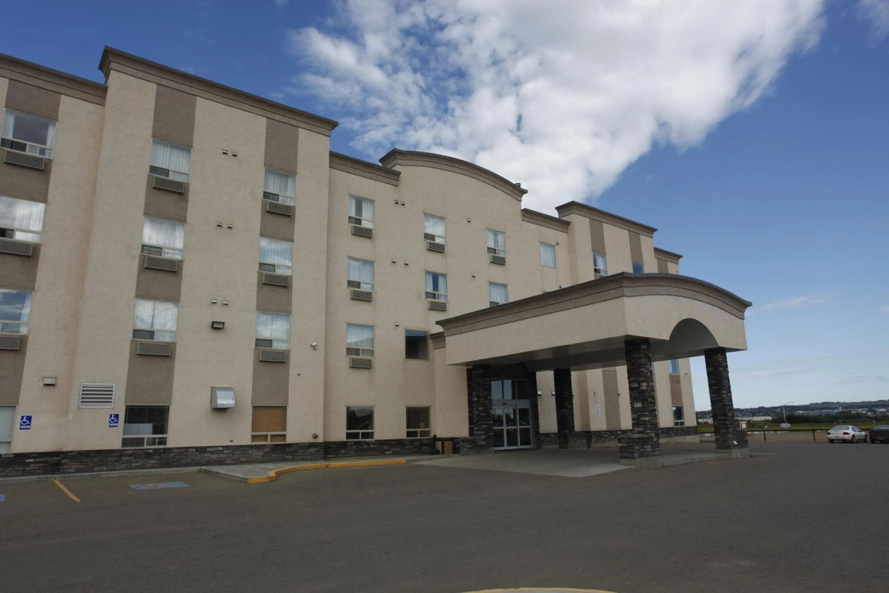 Facade/entrance in Pomeroy Inn and Suites Dawson Creek
