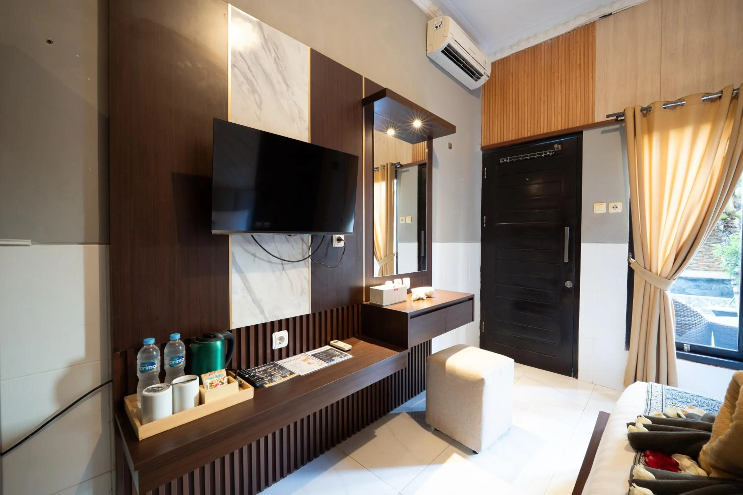 Communal lounge/ TV room, Bed in Wana Kubu Homestay