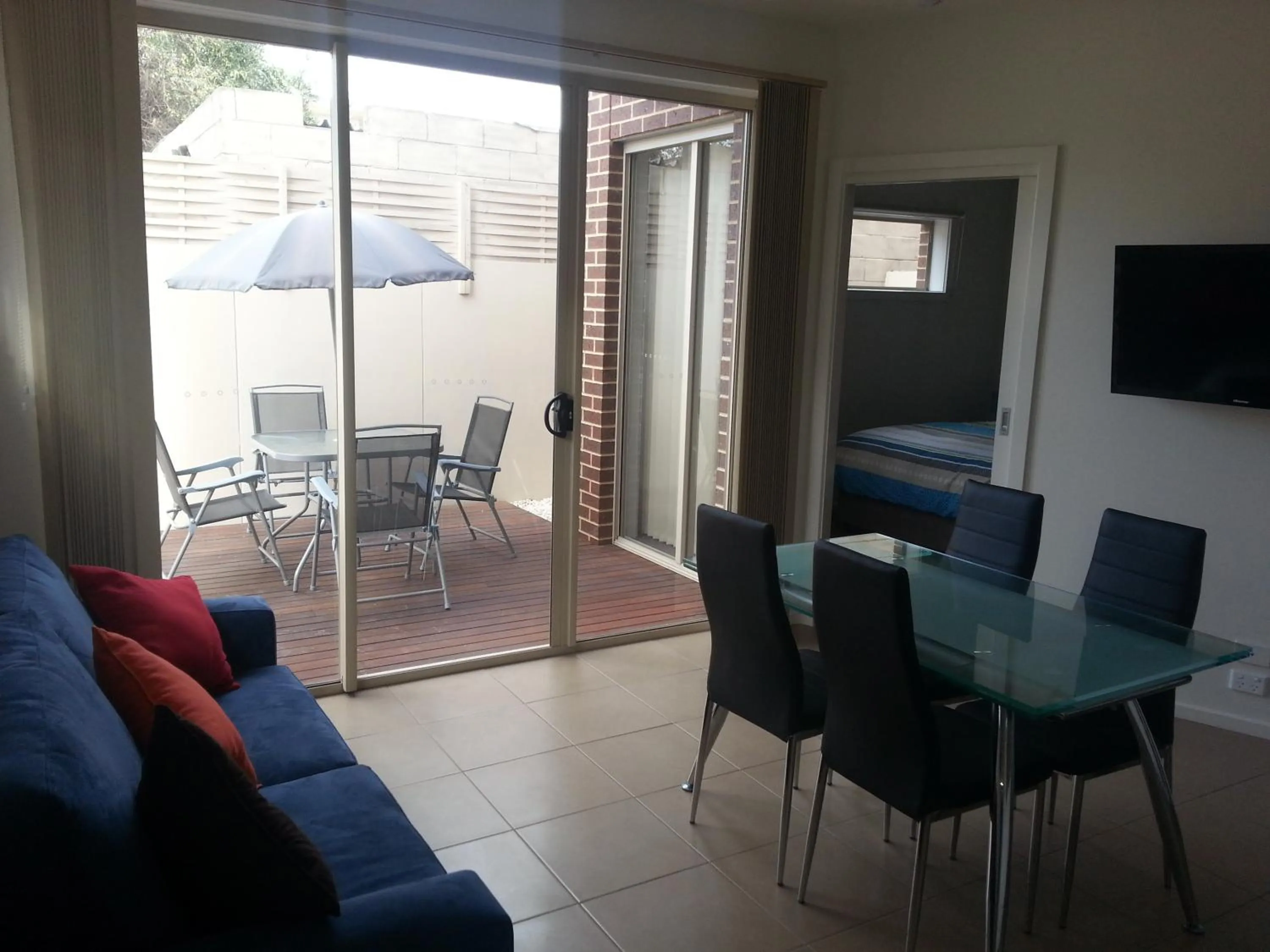 Living room in McKillop Geelong by Gold Star Stays