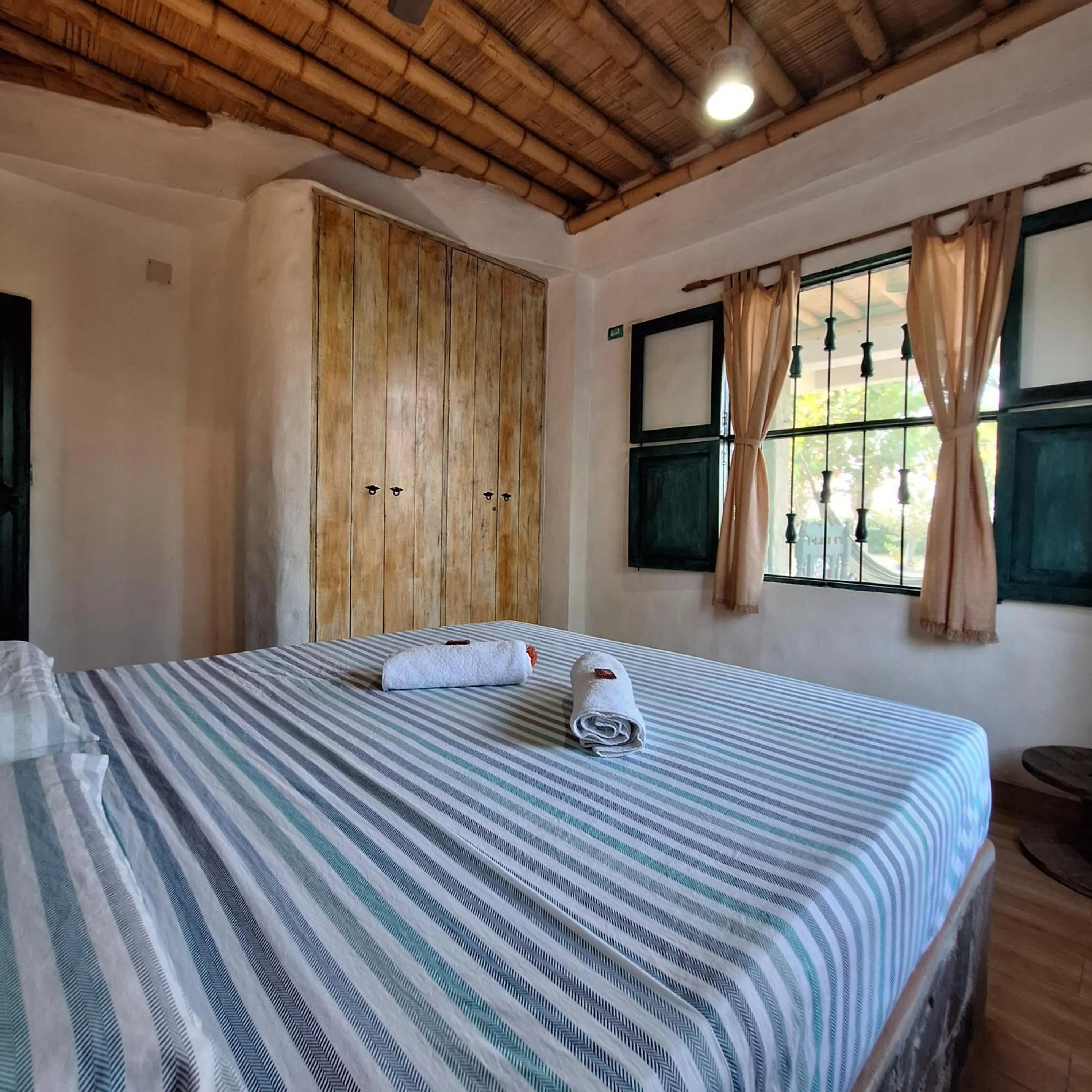 Photo of the whole room, Bed in Eco-Hotel Chevere Beach