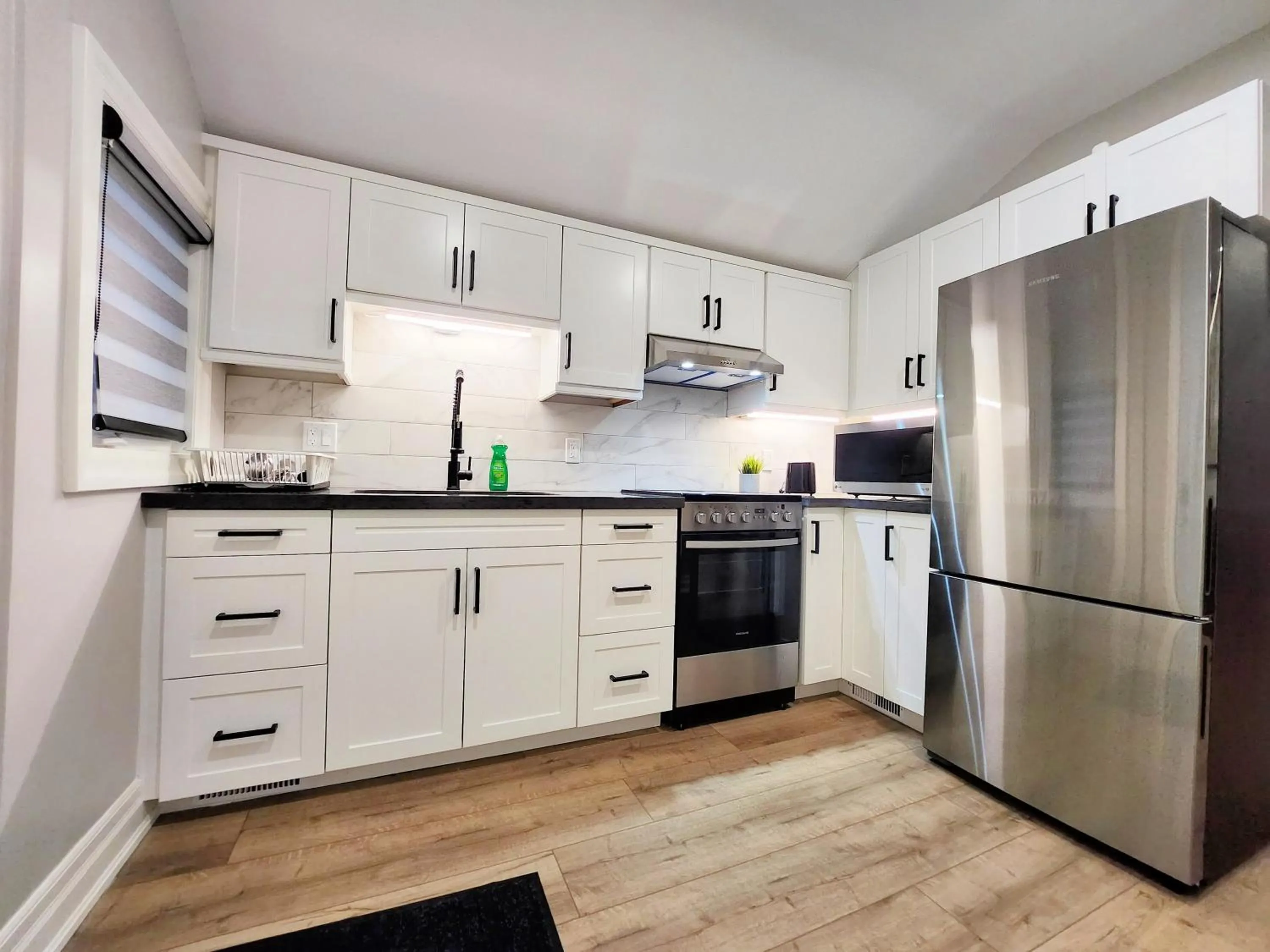 Kitchen or kitchenette in The Cozy Cove Modern King-Bedroom Full Apartment