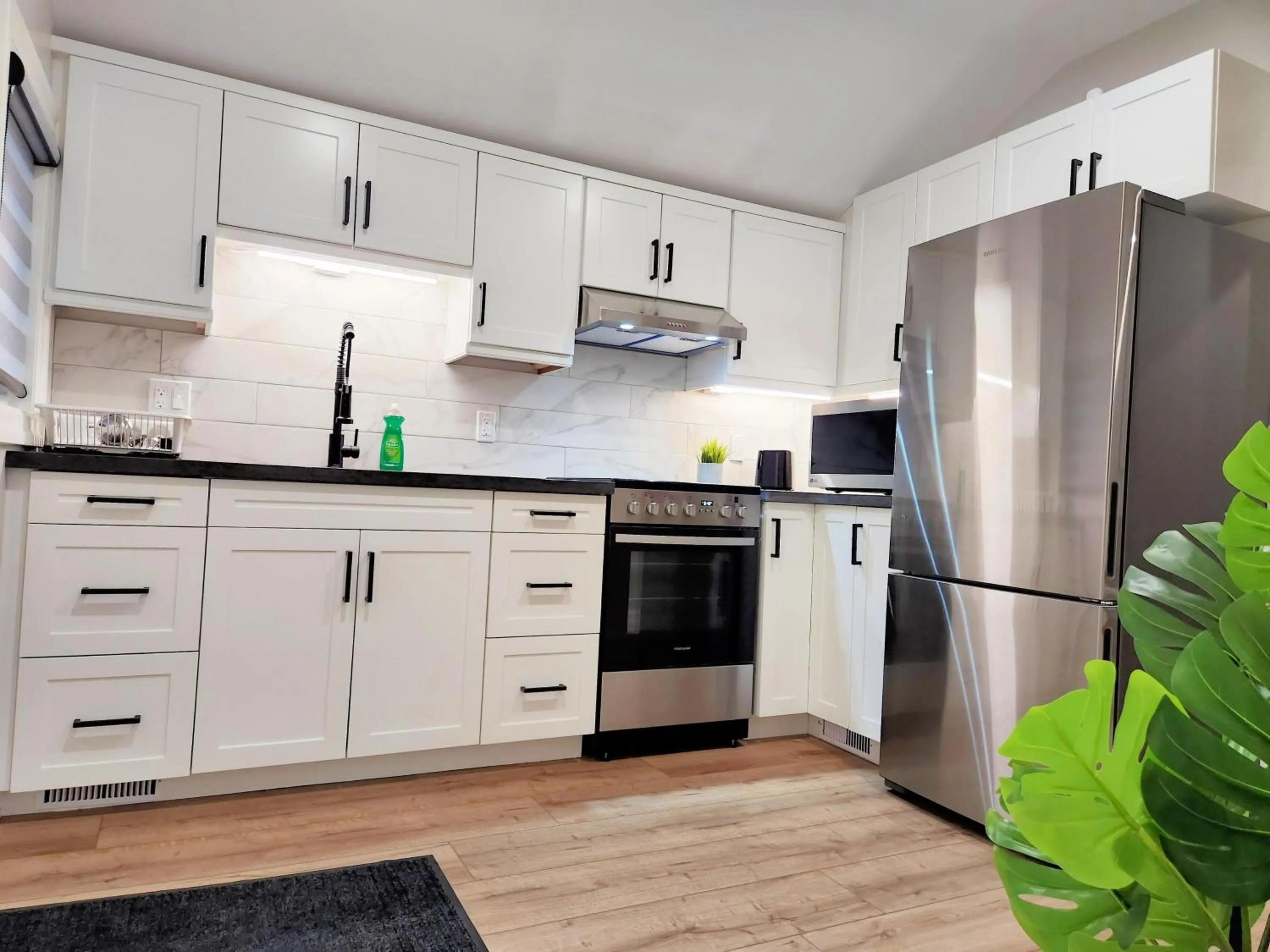 Kitchen or kitchenette in The Cozy Cove Modern King-Bedroom Full Apartment